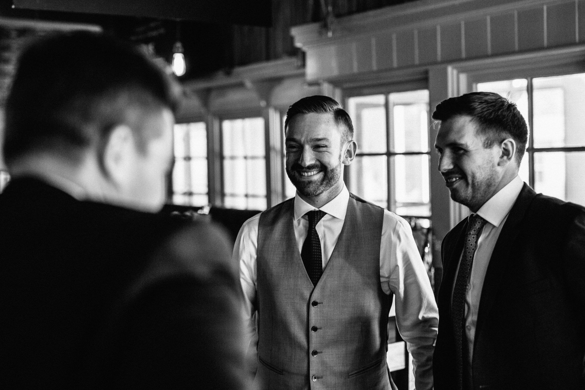  Groom smiling in the pub 
