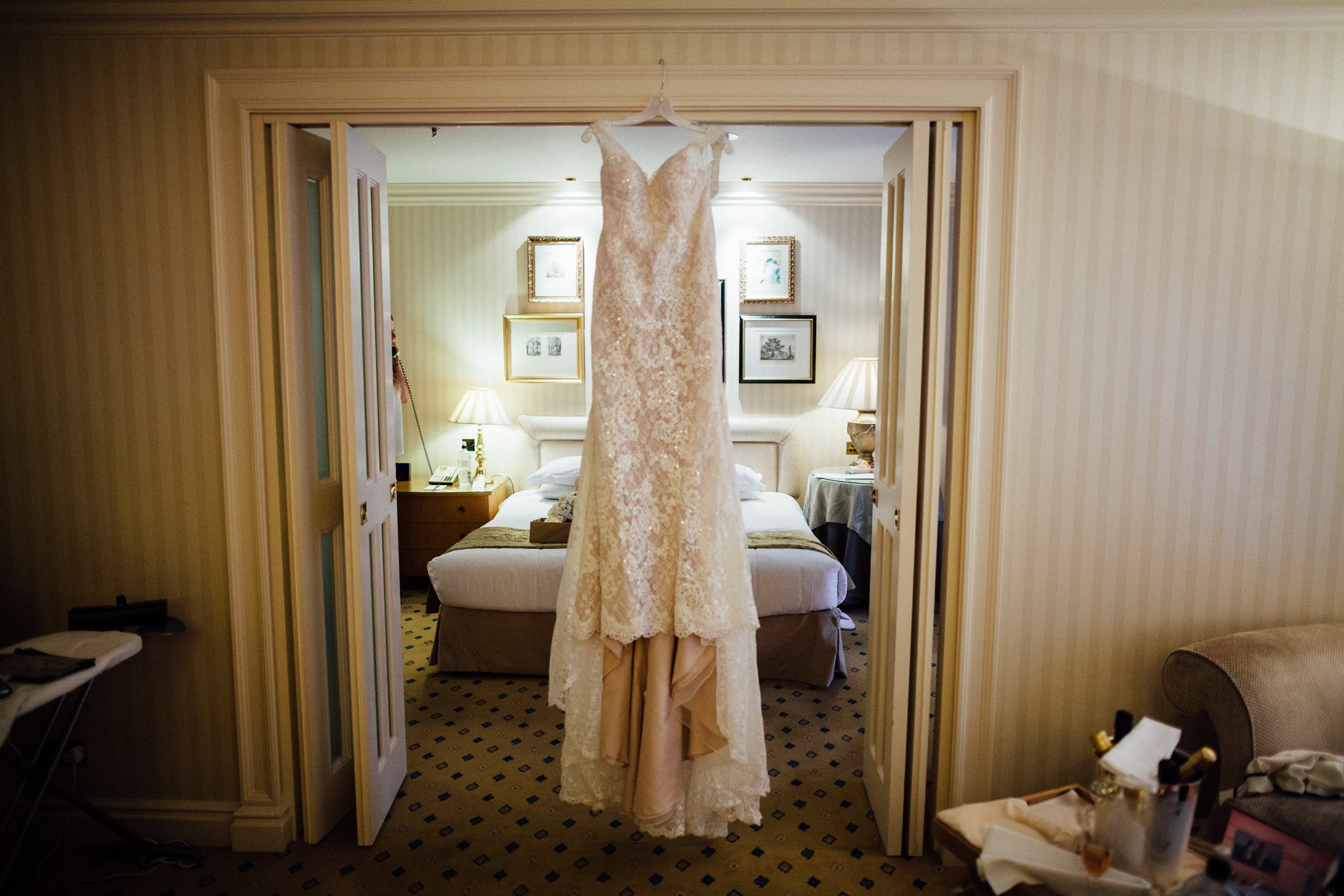  Wedding dress hanging up in a doorway in The Landmark London hotel 