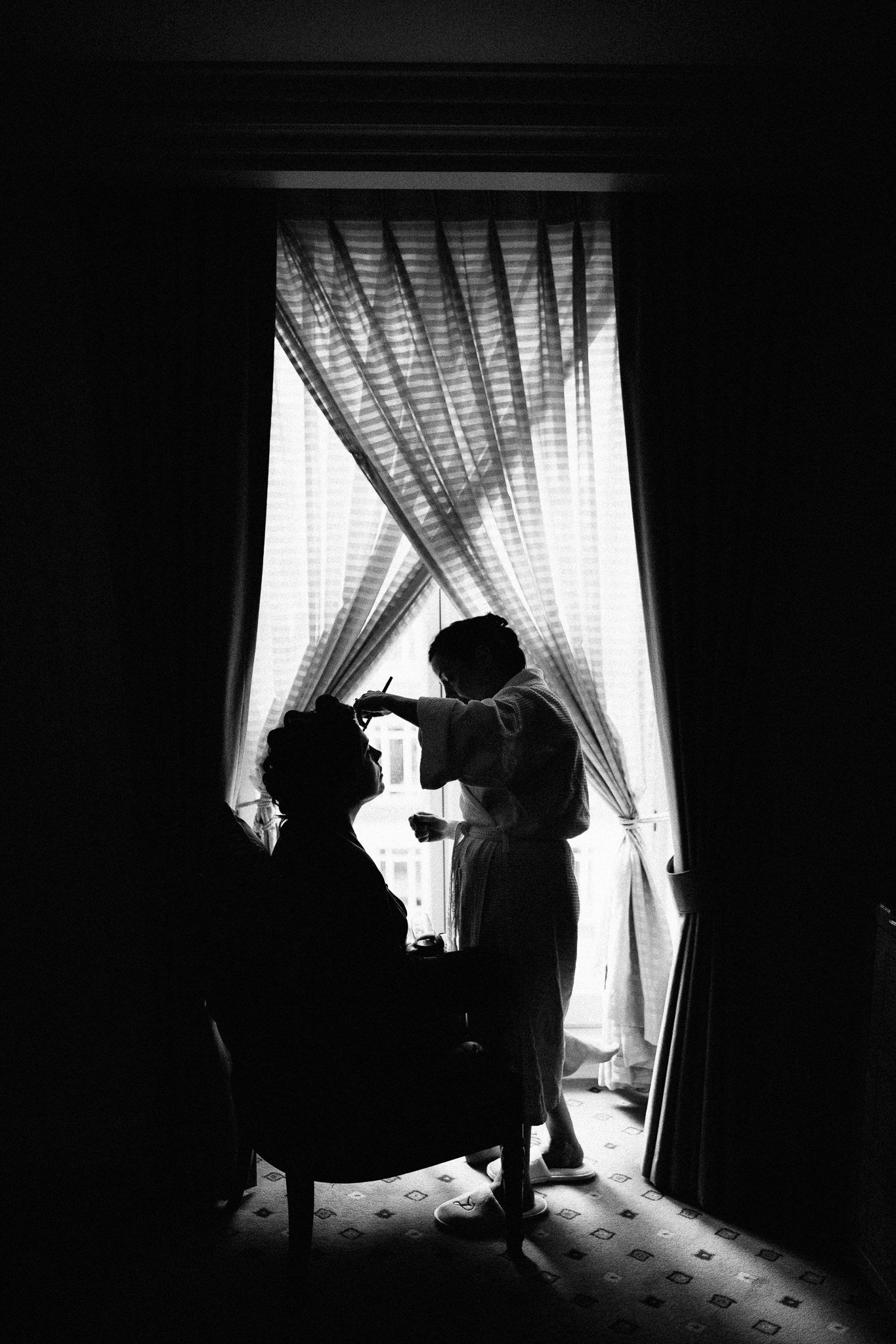  Silhouette of the Bride having makeup applied 
