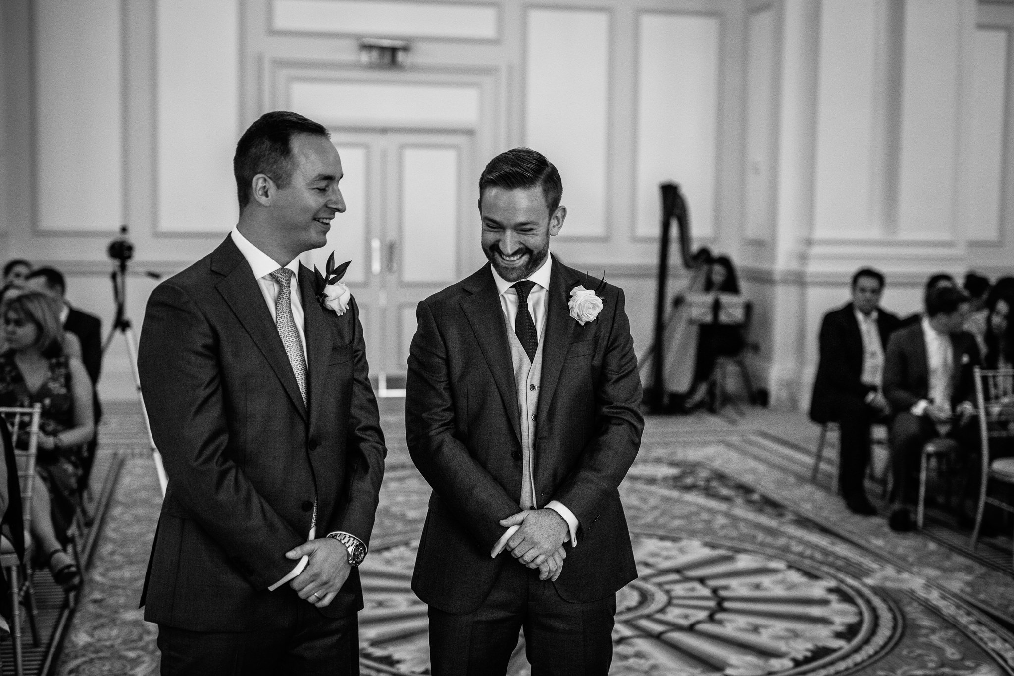  Groom and best man laughing 