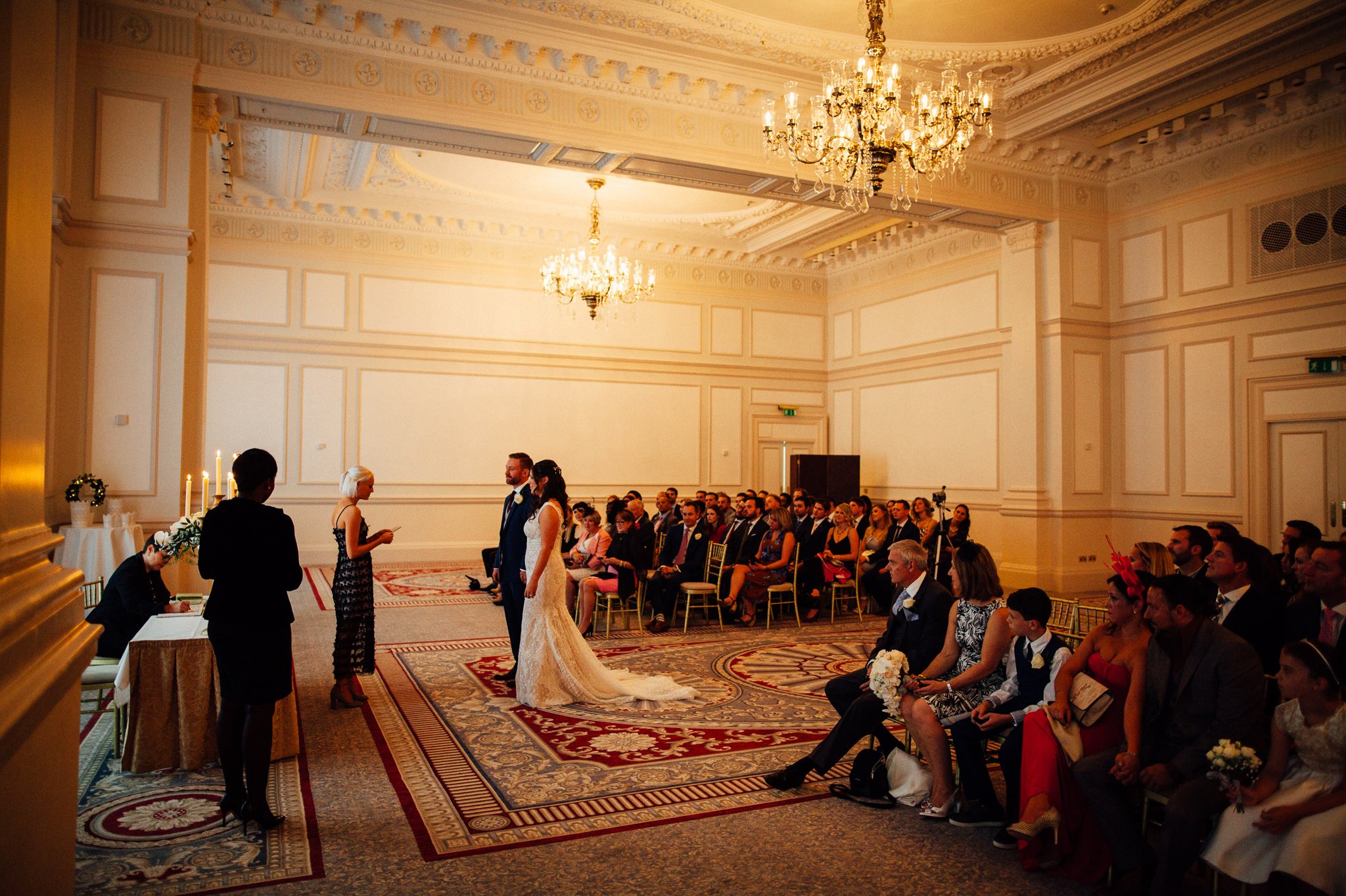  Lady gives a reading in front of the wedding party at The Landmark London hotel 