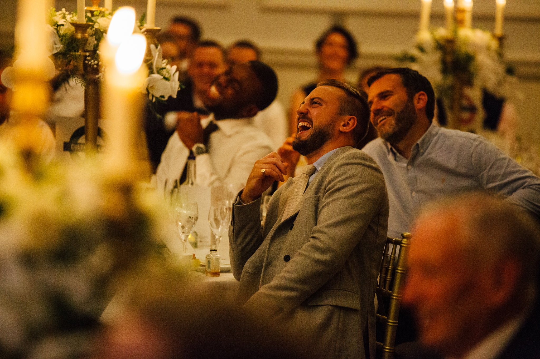  Male guest laughing during the speeches 