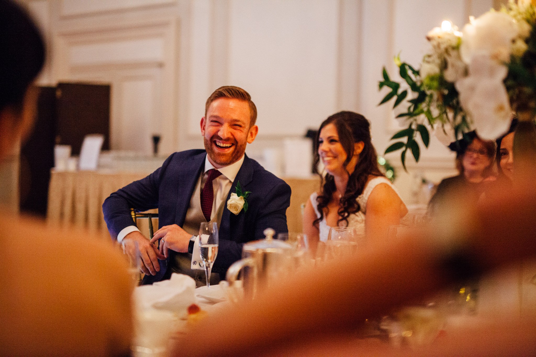  Groom laughing during the speeches 