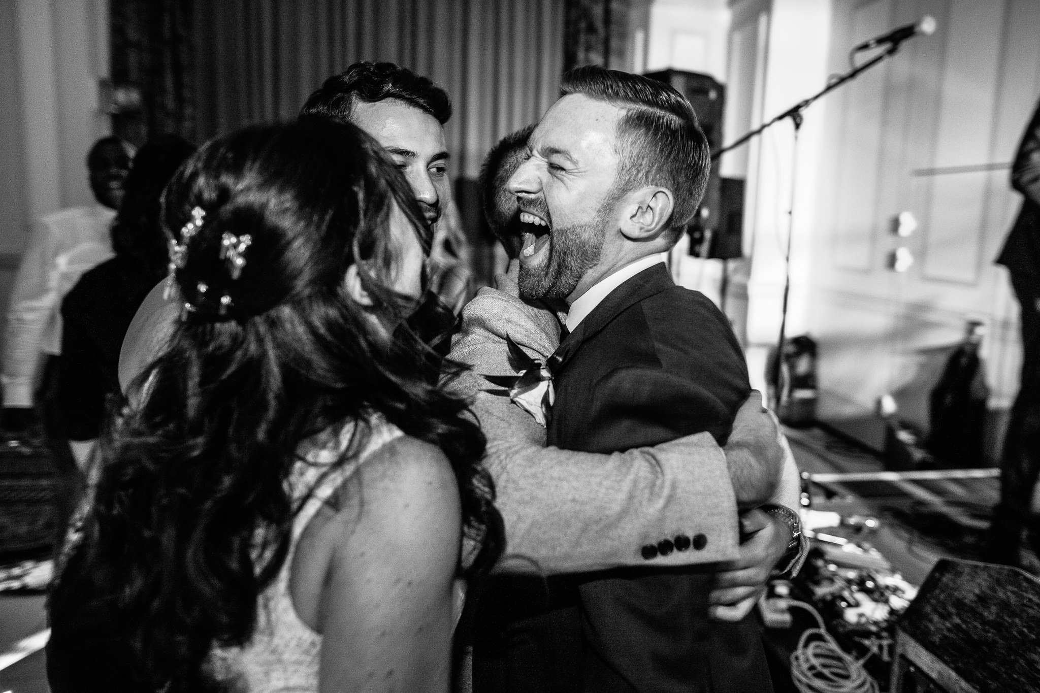  Groom being hugged on the dance fllor 