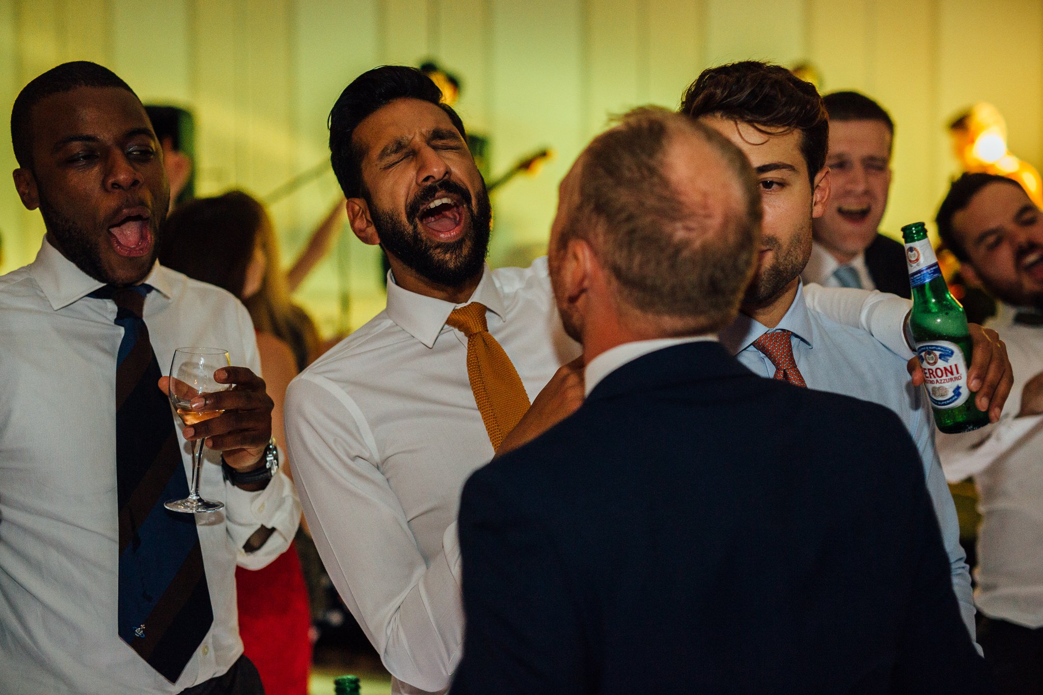  Male guest singing on the dancefloor with his eyes closed at The Landmark London hotel 