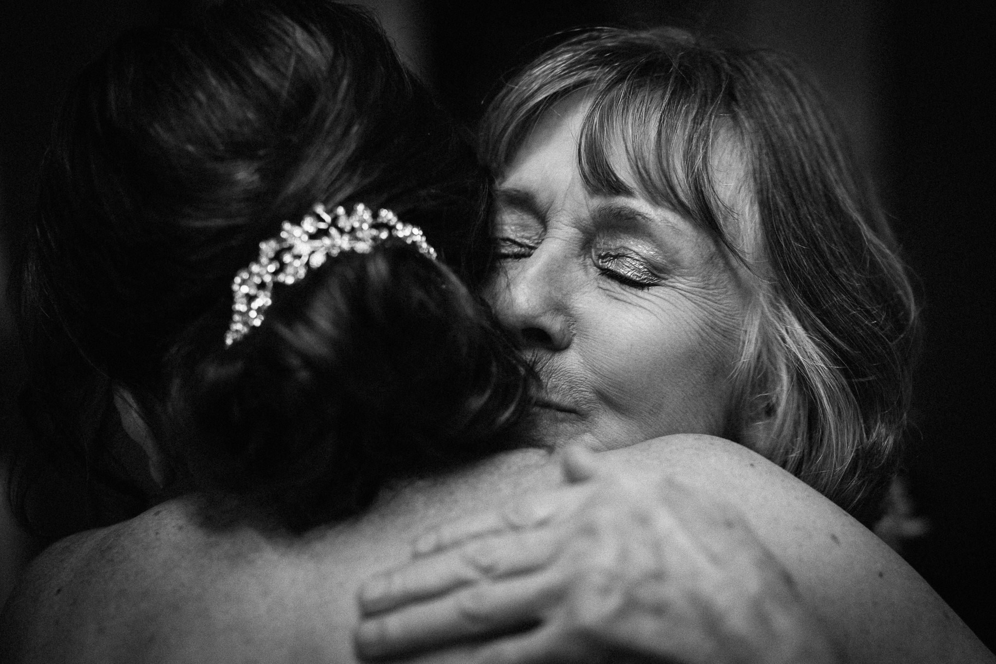  Mother of the Bride hugs the bride at Oxford Register Office 