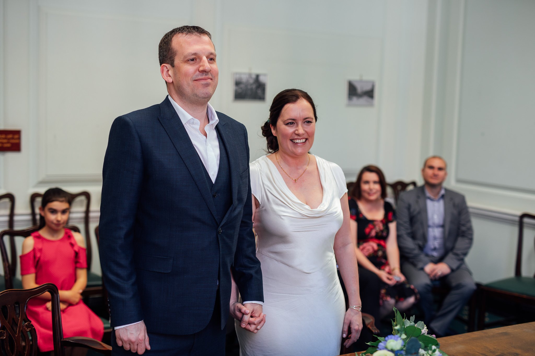  Bride and Groom holding hands at Camden Town Hall 