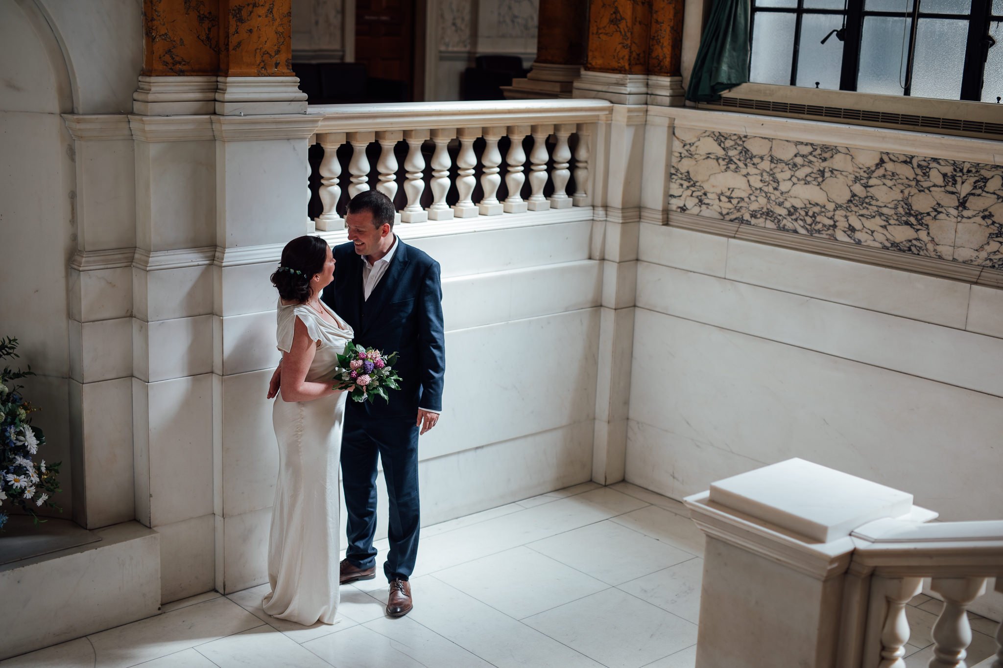  Bride and Groom hold each other at Camden Town Hall 