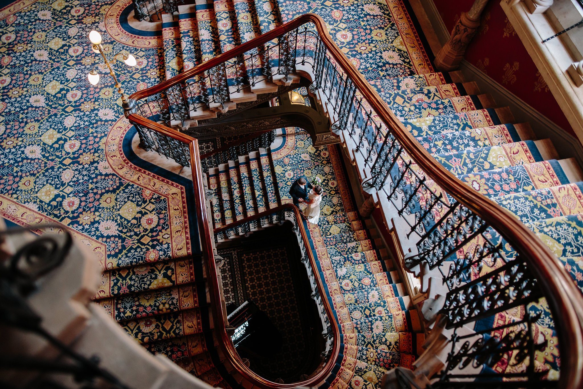  Bride and Groom as seen from above on the staircase at St. Pancras Renaissance Hotel London 
