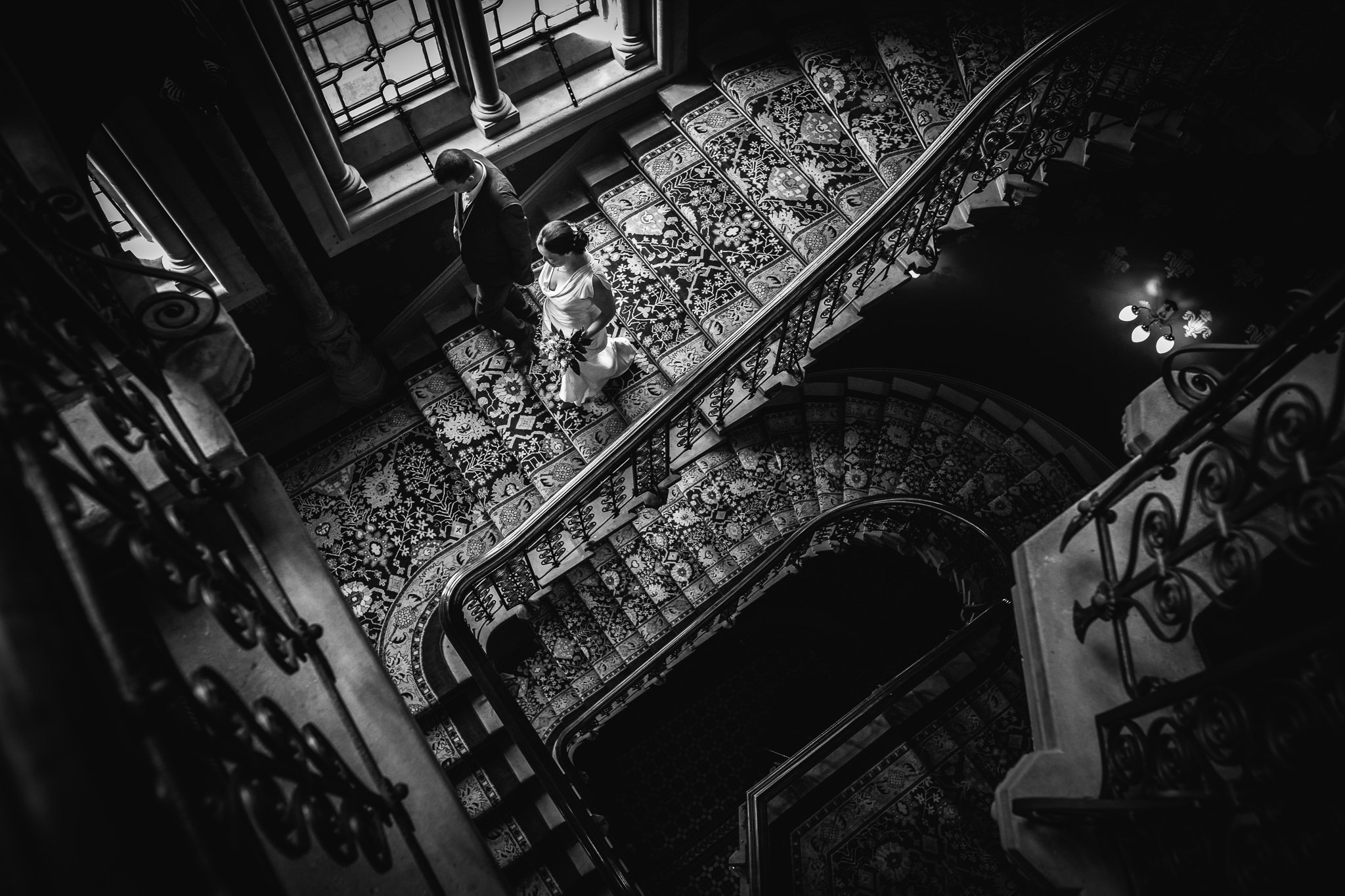  Bride and Groom going down the stairs at St. Pancras Renaissance Hotel London 