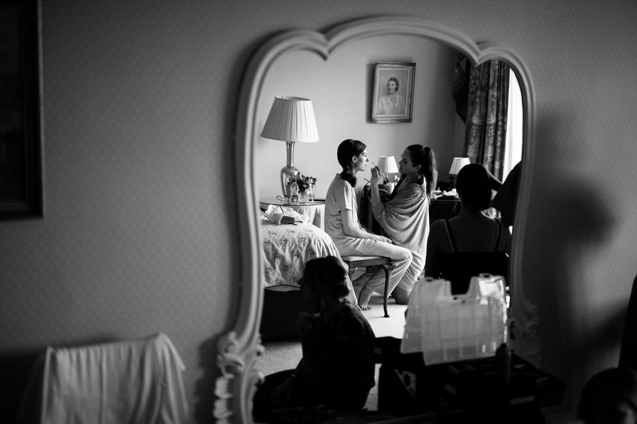  Reflection in large mirror of bride on her wedding day at Wadhurst castle wedding venue 