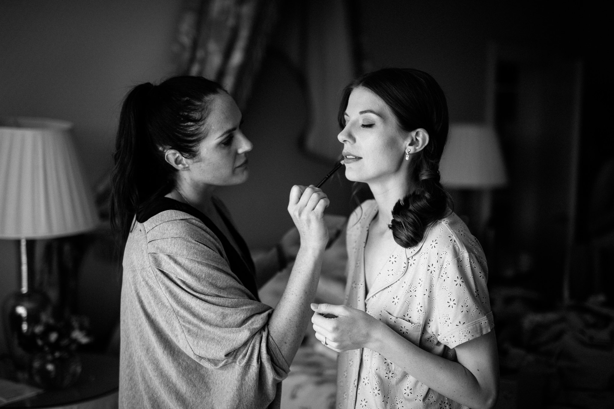  Bride having makeup applied to her lips 