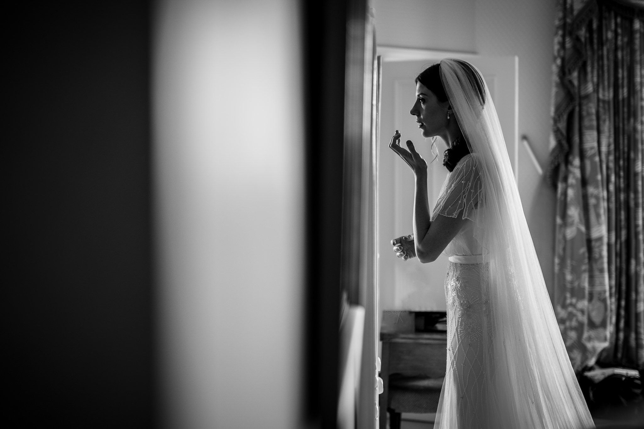  Bride looks at herself in the mirror 