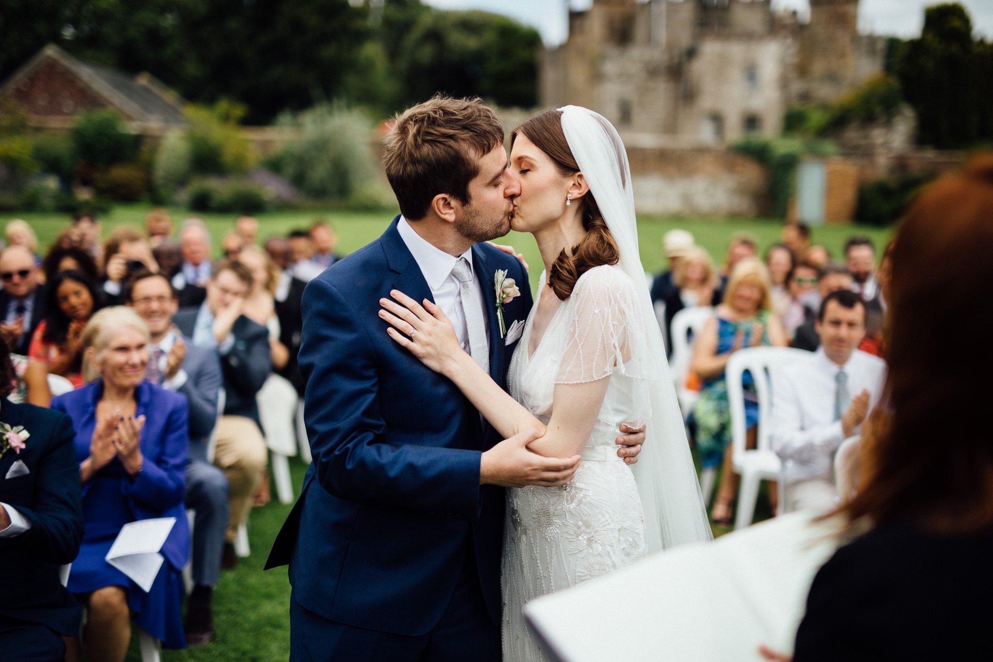 Bride and Groom kiss at  Wadhurst castle wedding venue 