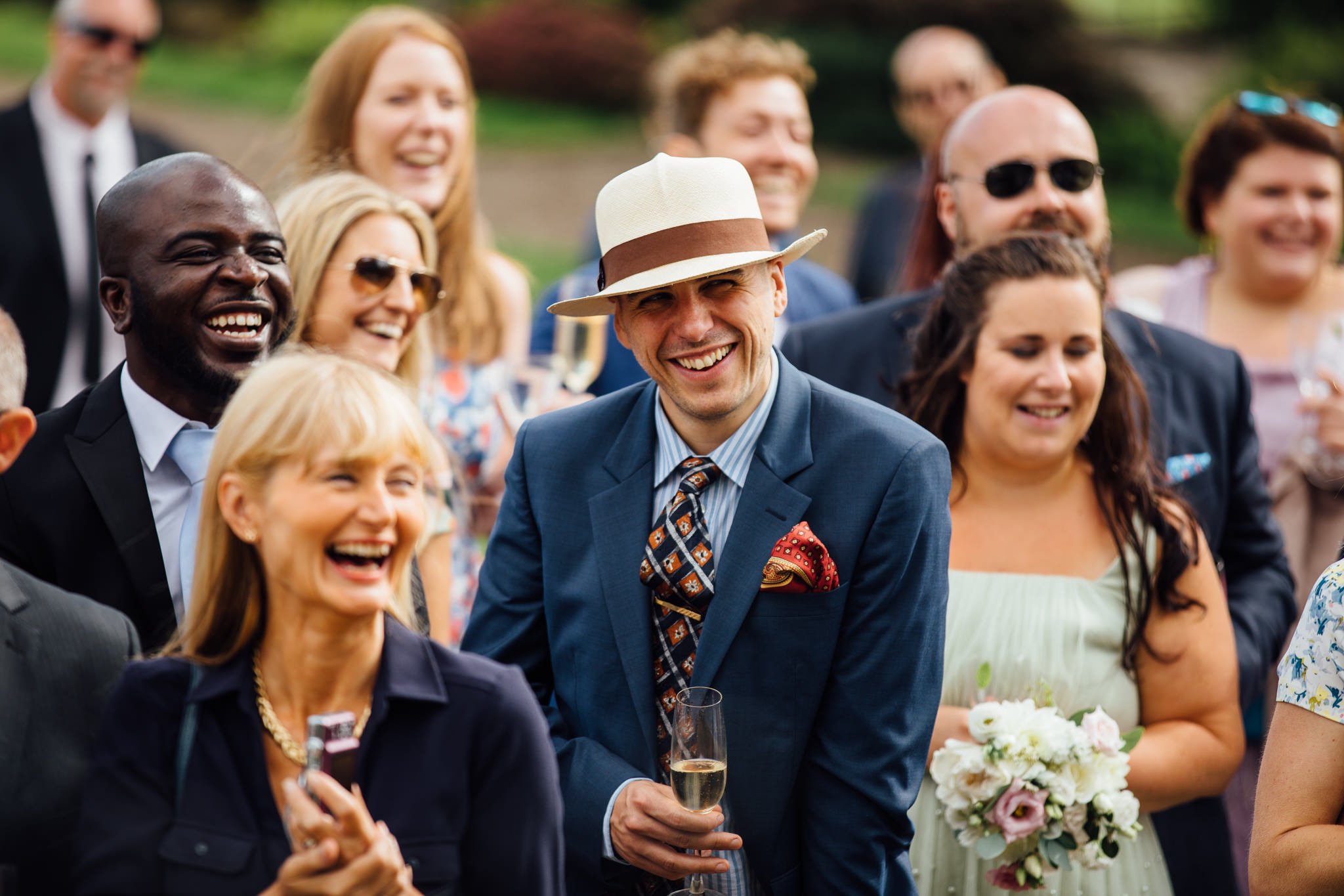 Male wedding guest smiling 