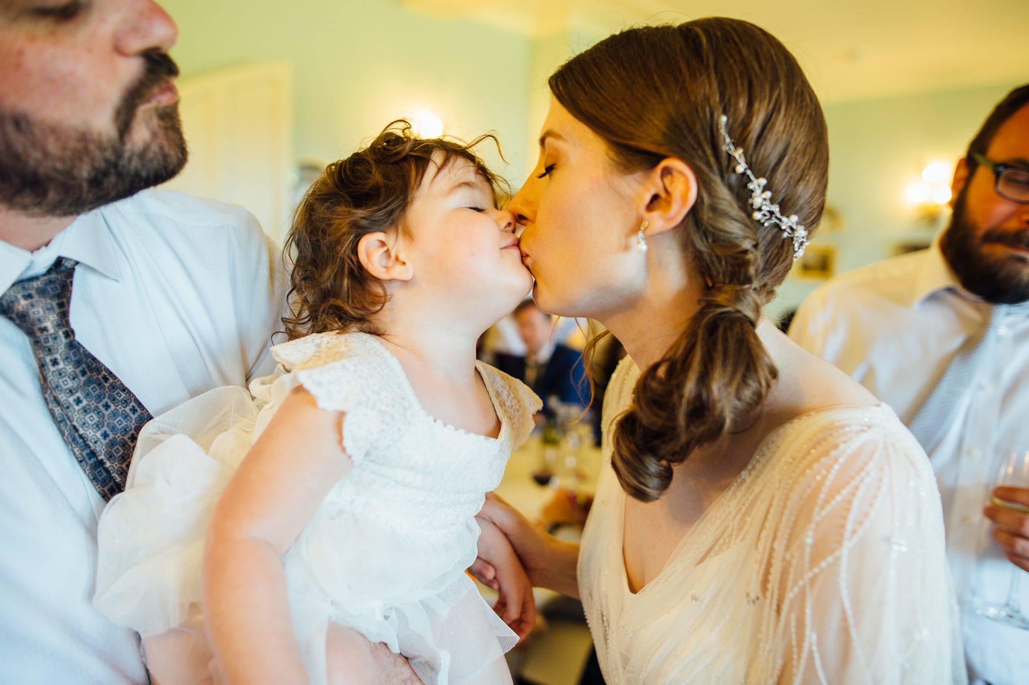  Bride and toddler kiss 