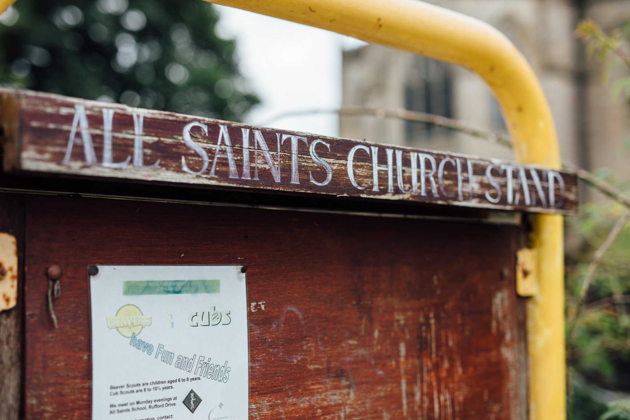  Sign saying all saints church stand 
