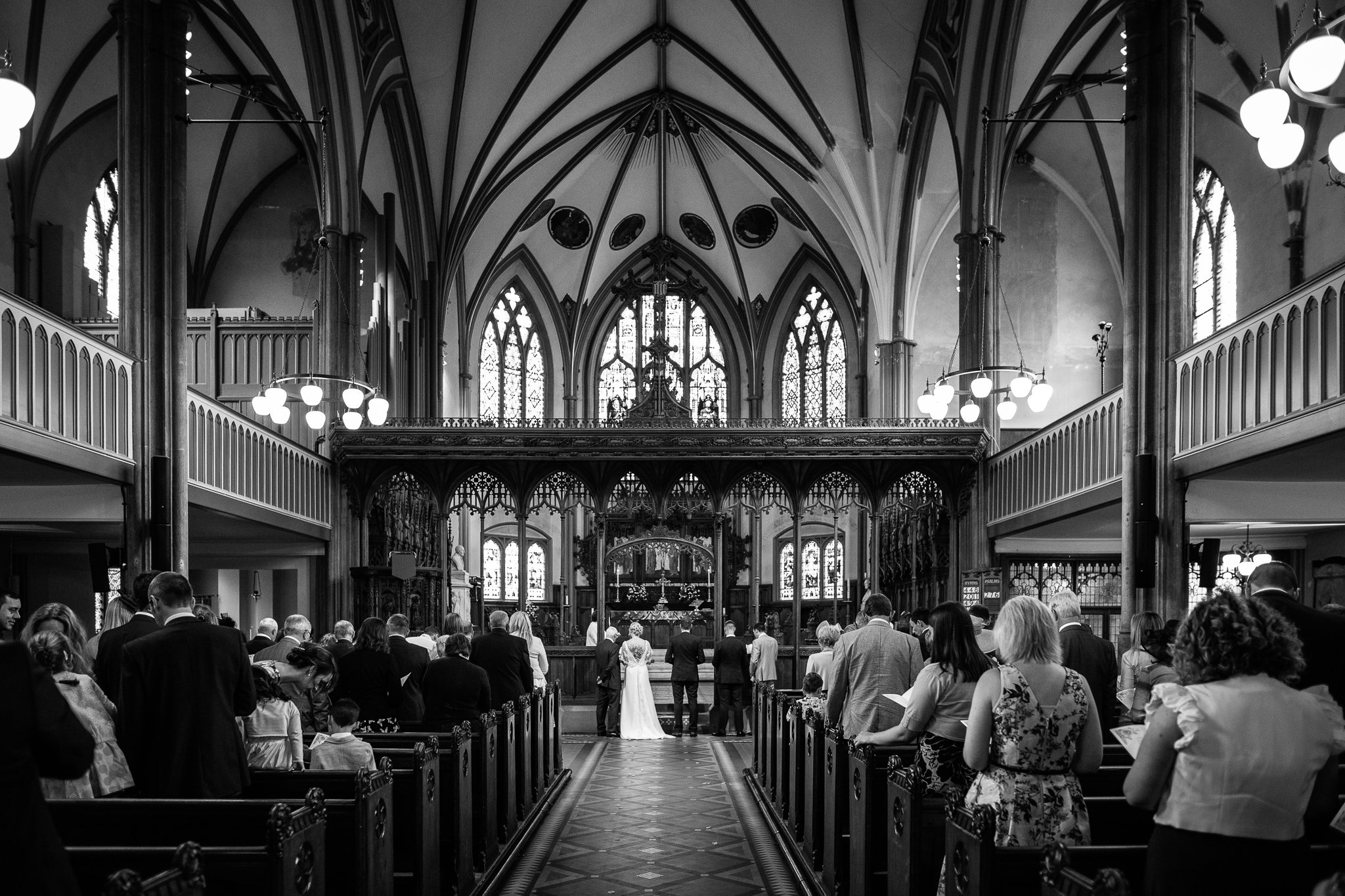  Wide angle shot of All Saints Stand Church Whitefield during the wedding ceremony 