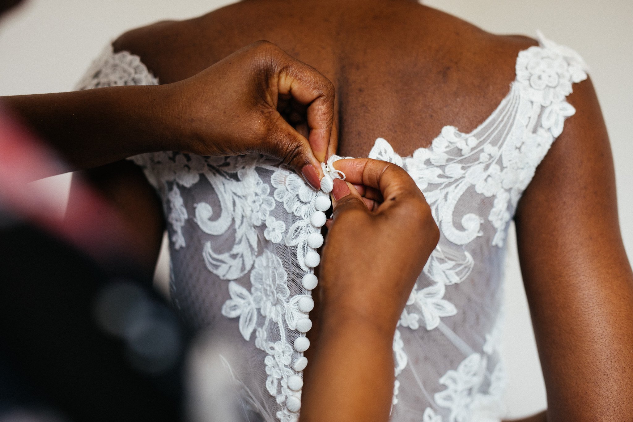  Wedding dress being done up 