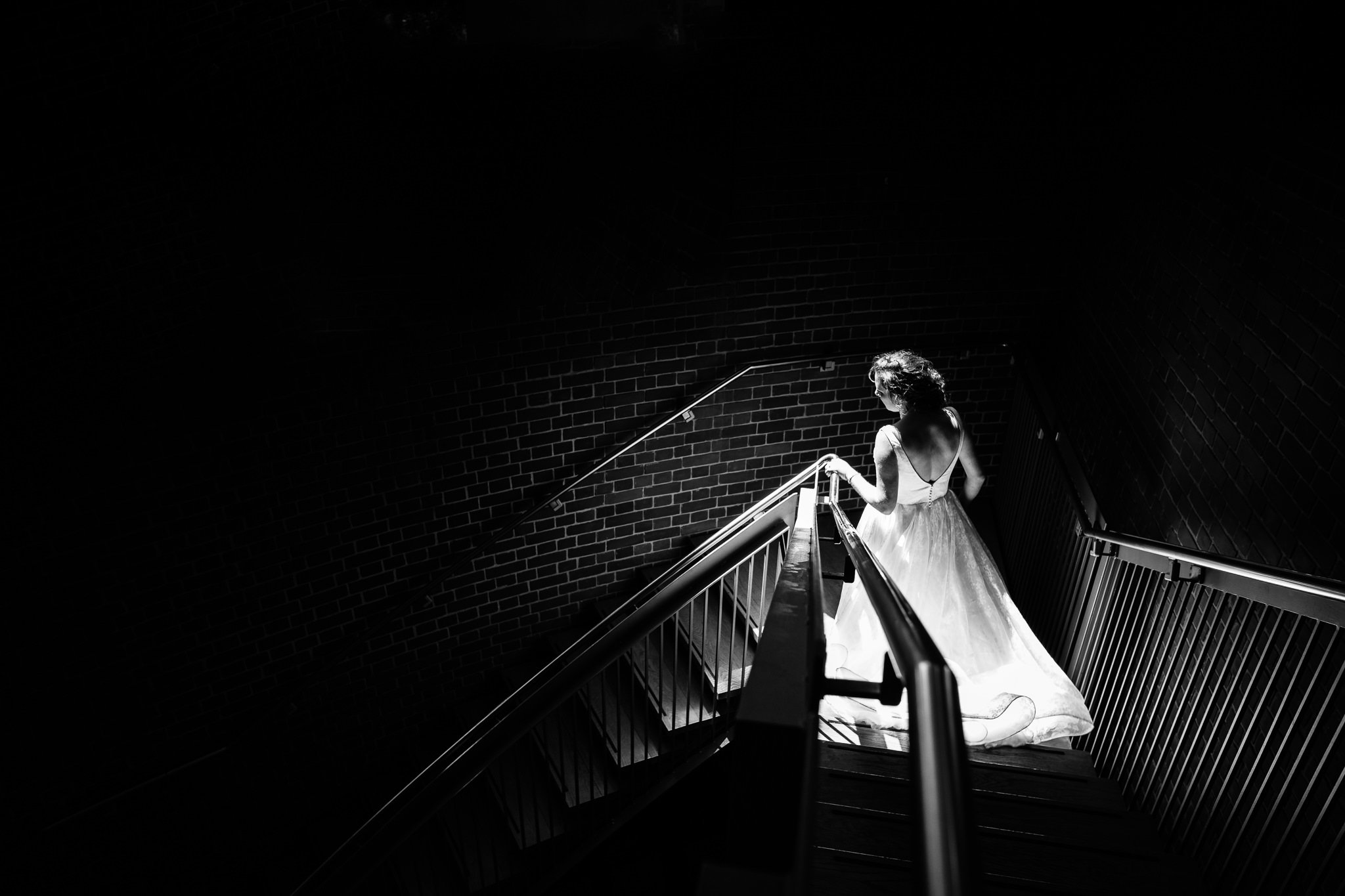  Bride descends the stairs at Inside of All Saints West Dulwich Church 