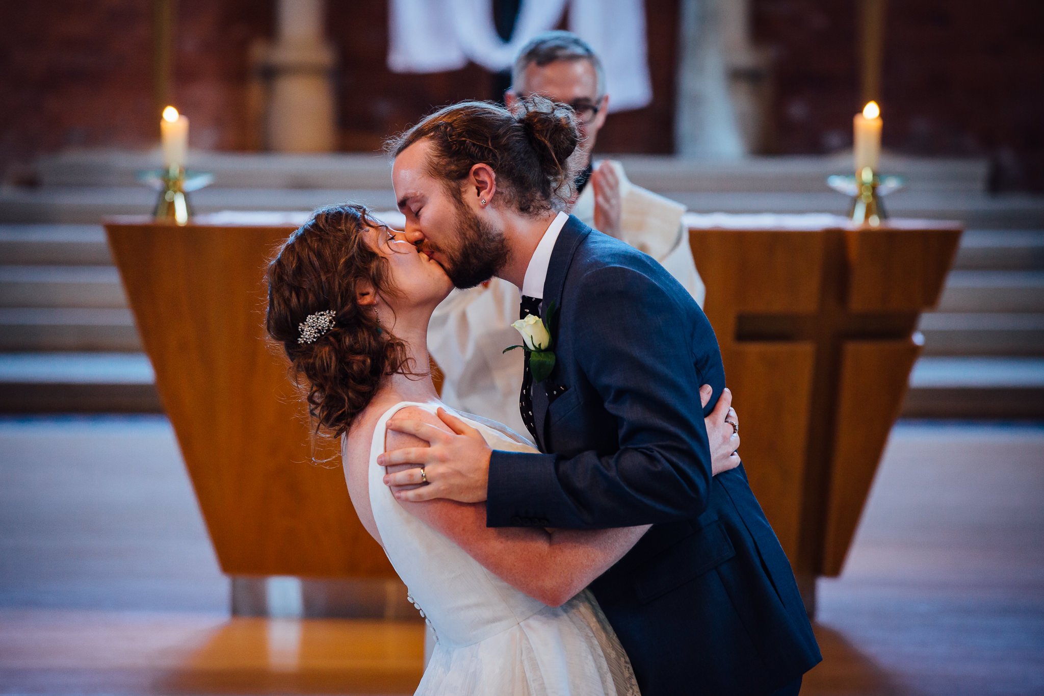  Bride and Groom kiss after being married at Inside of All Saints West Dulwich Church 