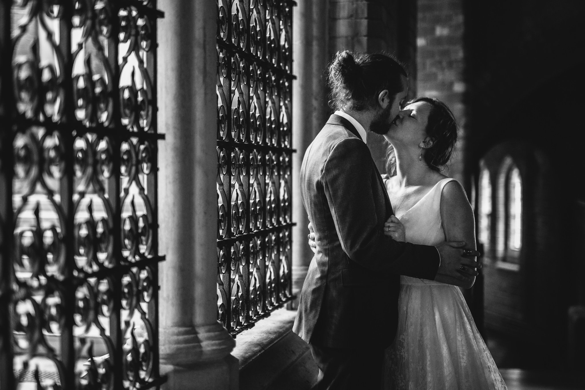  Bride and Groom kiss at Inside of All Saints West Dulwich Church 