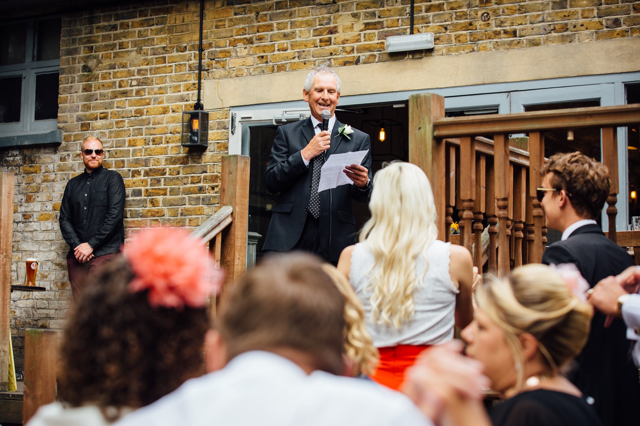  Man gives speech to guests 