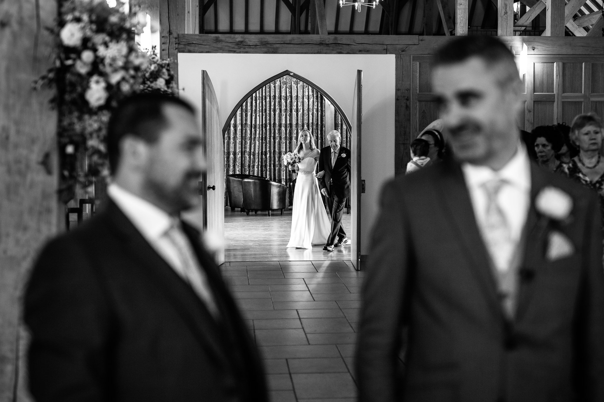 Bride enters the ceremony room with her father at Rivervale Barn 