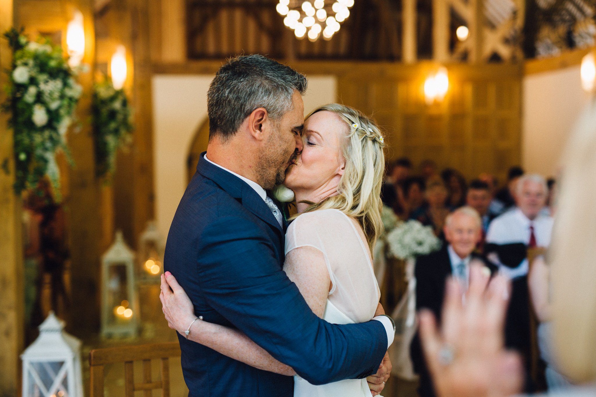  Bride and Groom kiss after their wedding ceremony at Rivervale Barn 