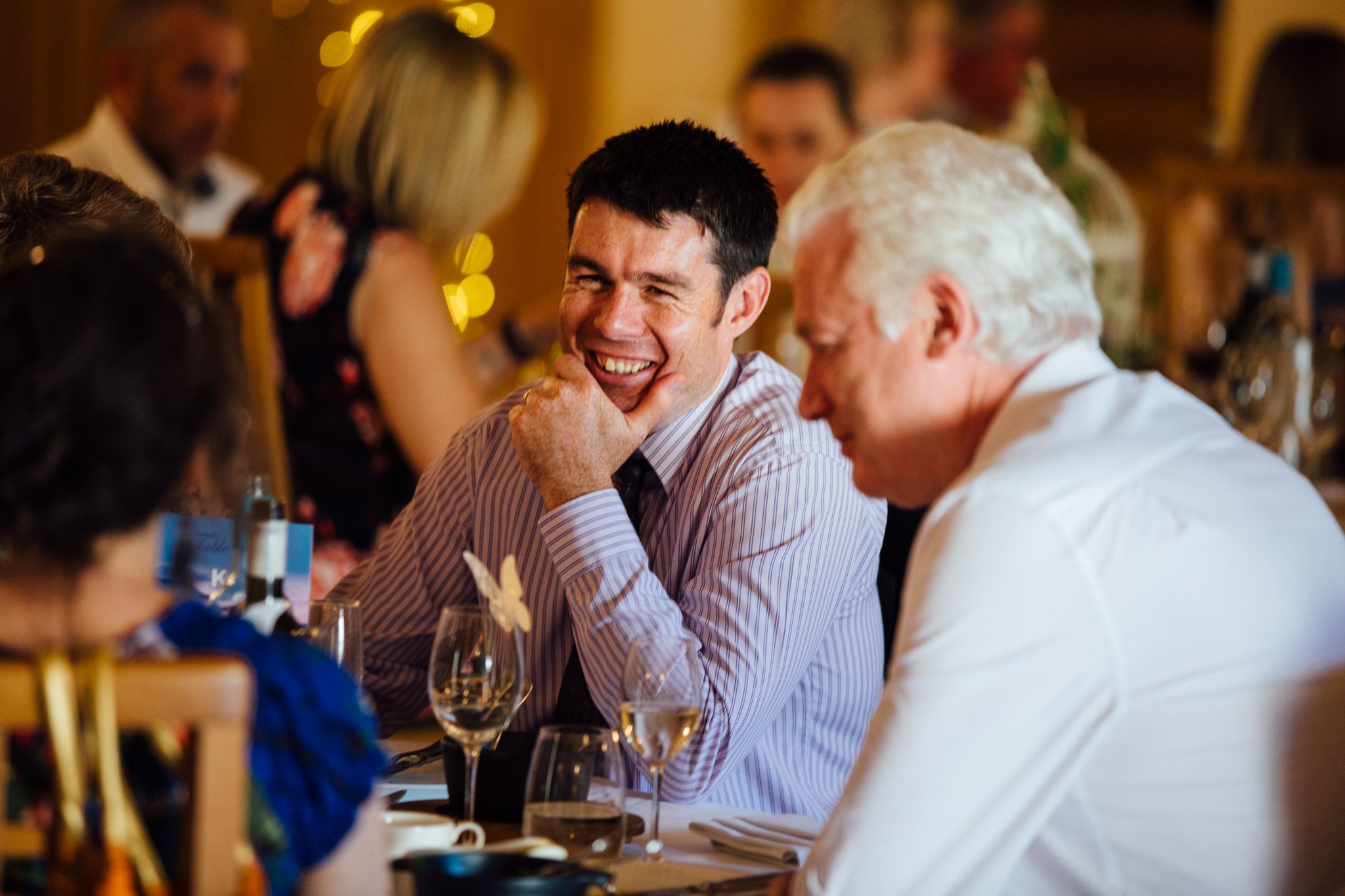  Wedding guest laughing at Rivervale Barn 