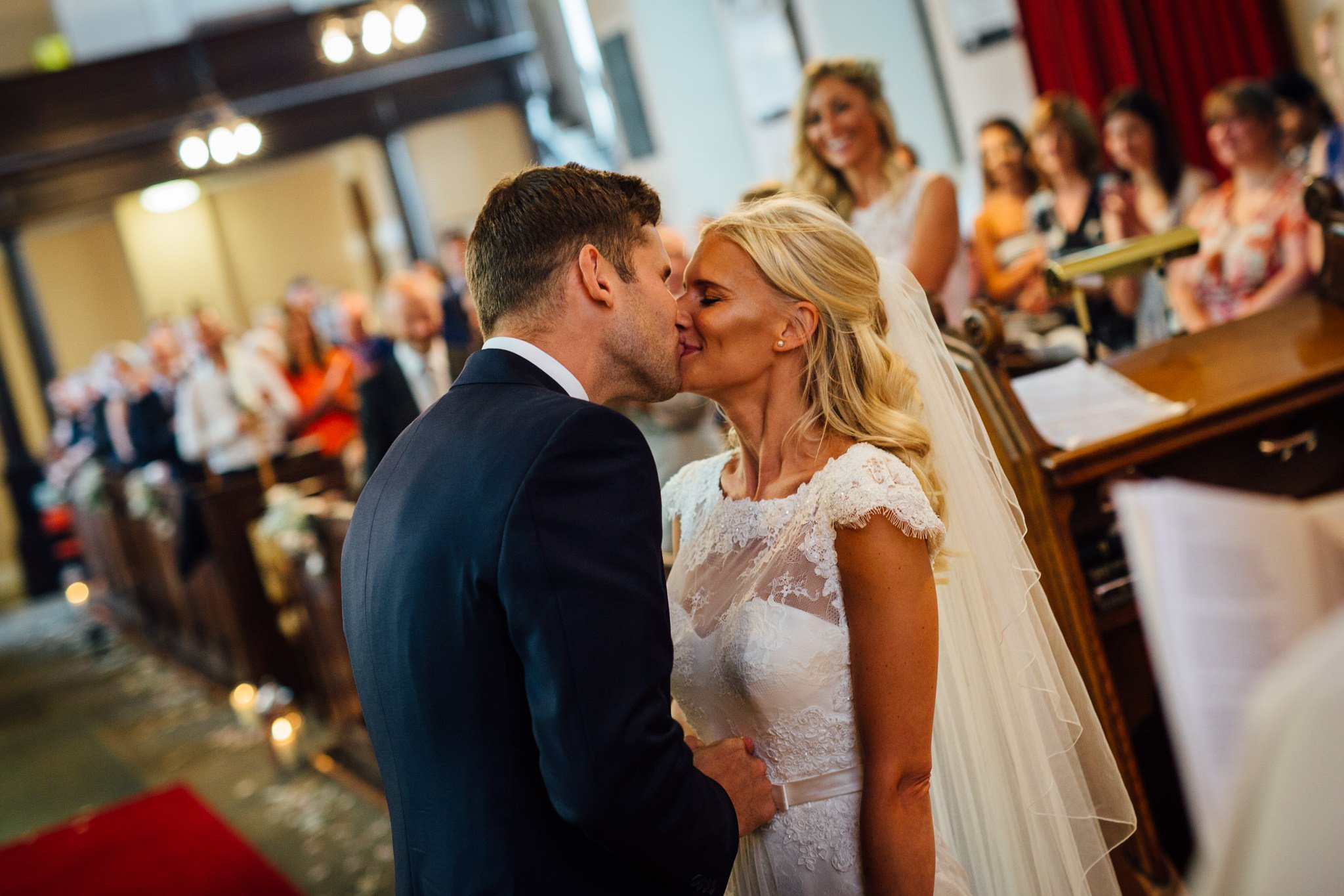  Bride and Groom kiss at St Michael's Church Aynho, Banbury OX17 3BQ 