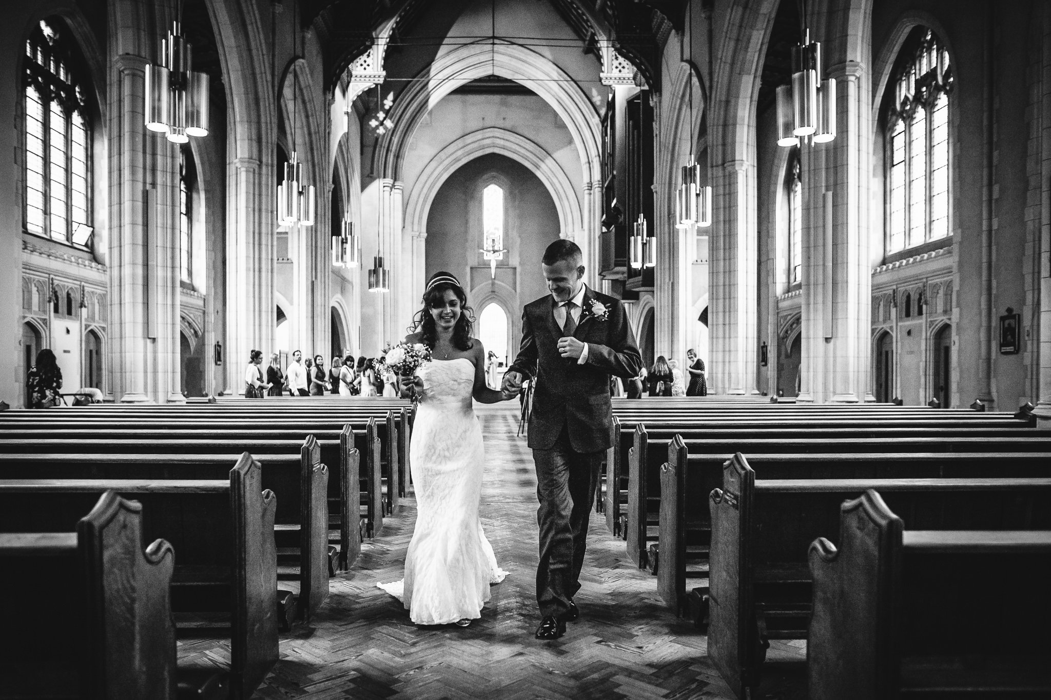  Bride and Groom walk down the aisle at Ealing Abbey 