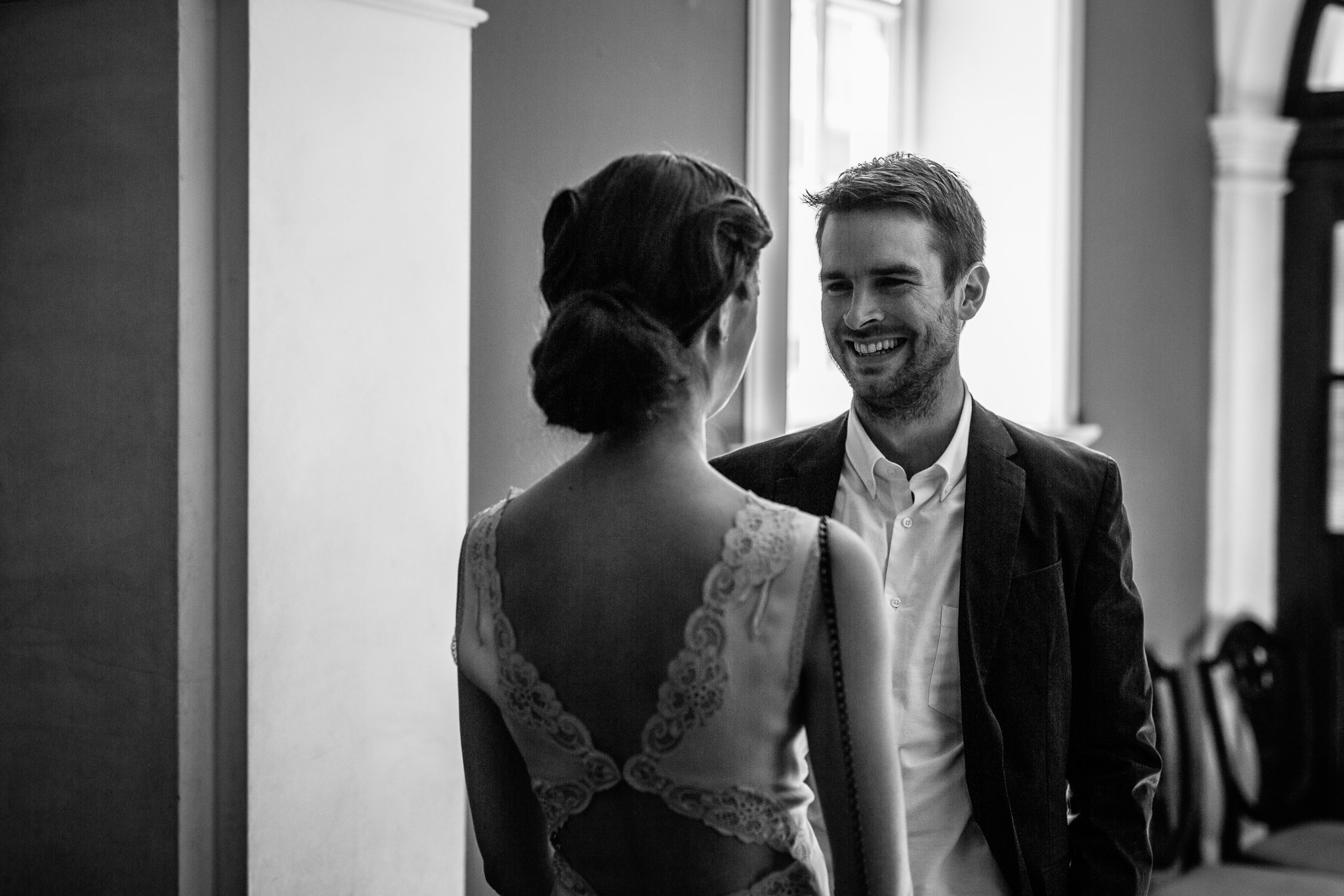  Groom smiling at Bride before the wedding ceremony at Chelsea Old Town Hall 
