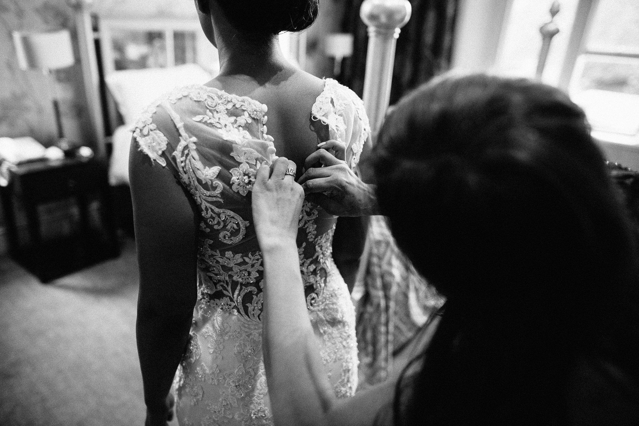  Bride has her dress fitted at Coulsdon Manor Hotel 