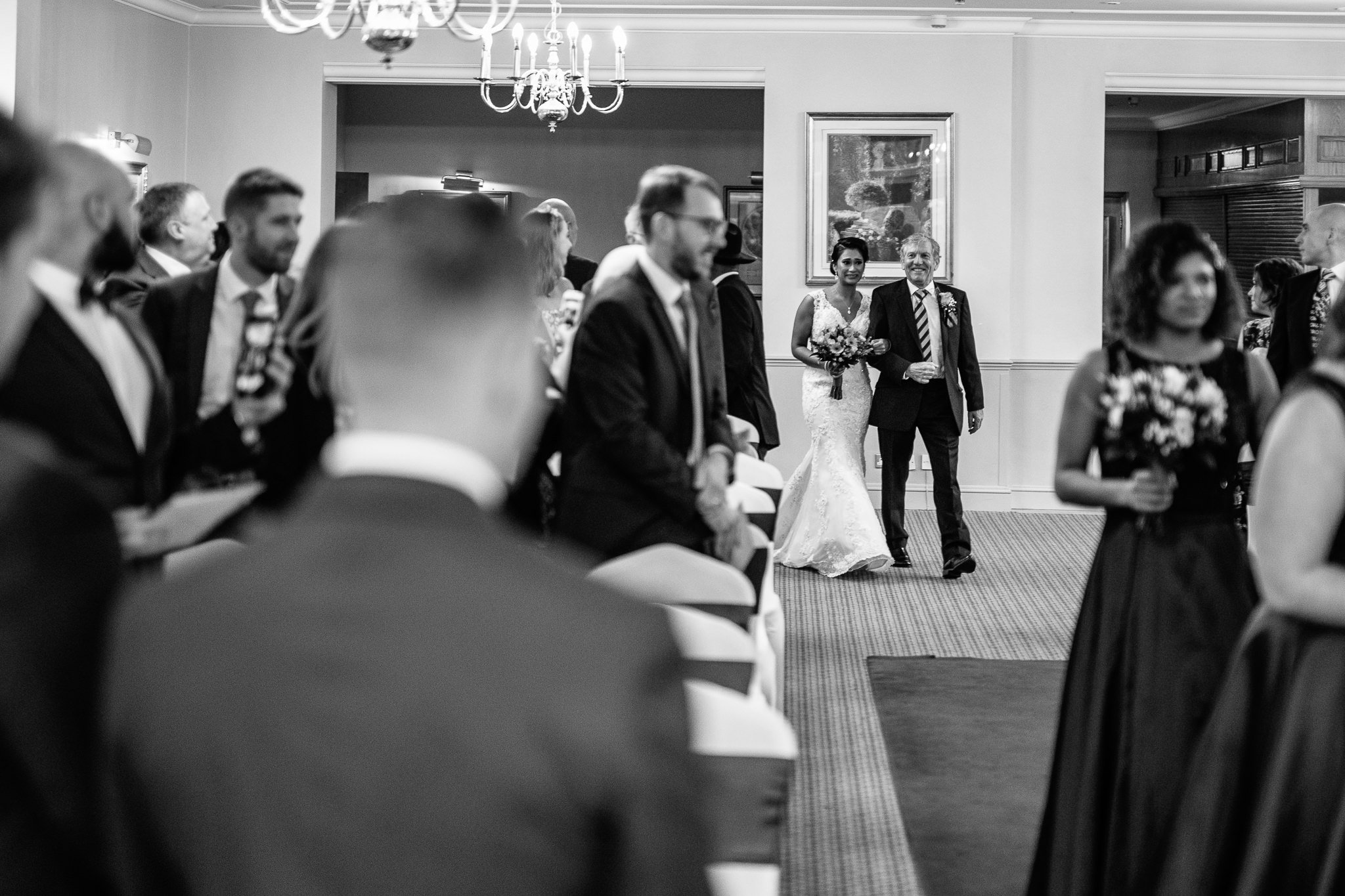  Bride walks down the aisle at Coulsdon Manor Hotel 