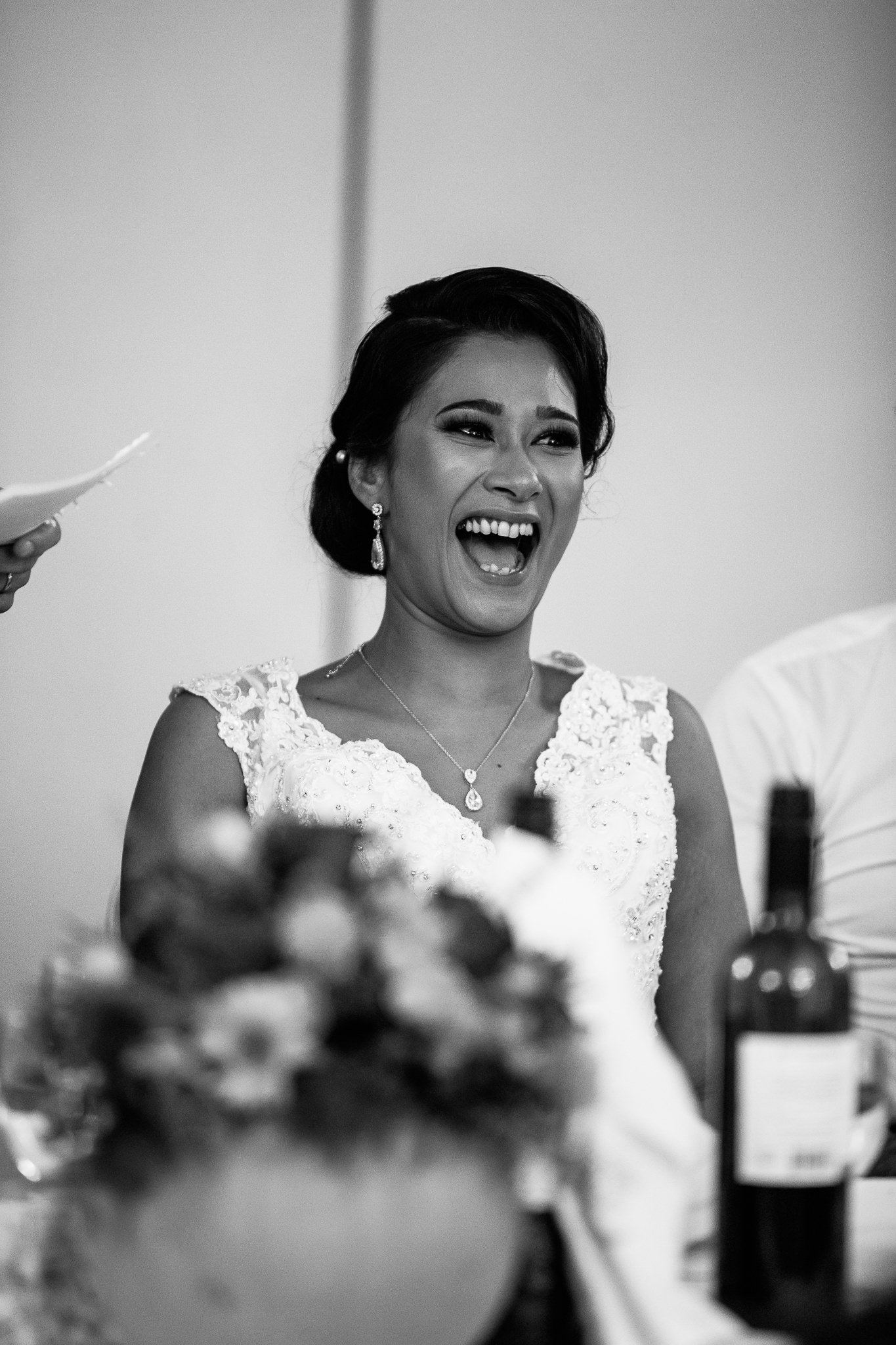  Bride laughing during the speeches 