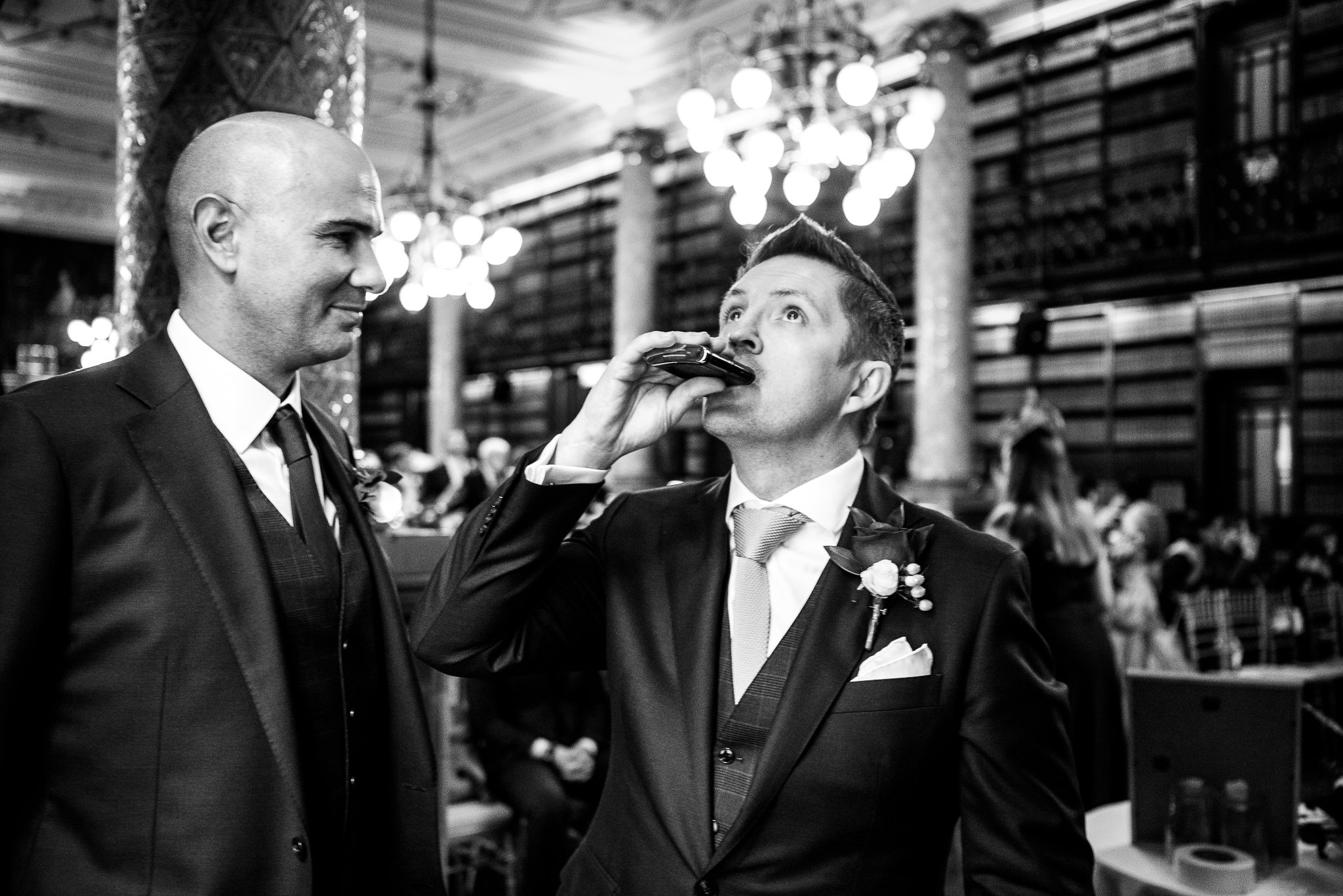  Groom takes a swig from a hipflask before the wedding ceremony at One Whitehall Place 