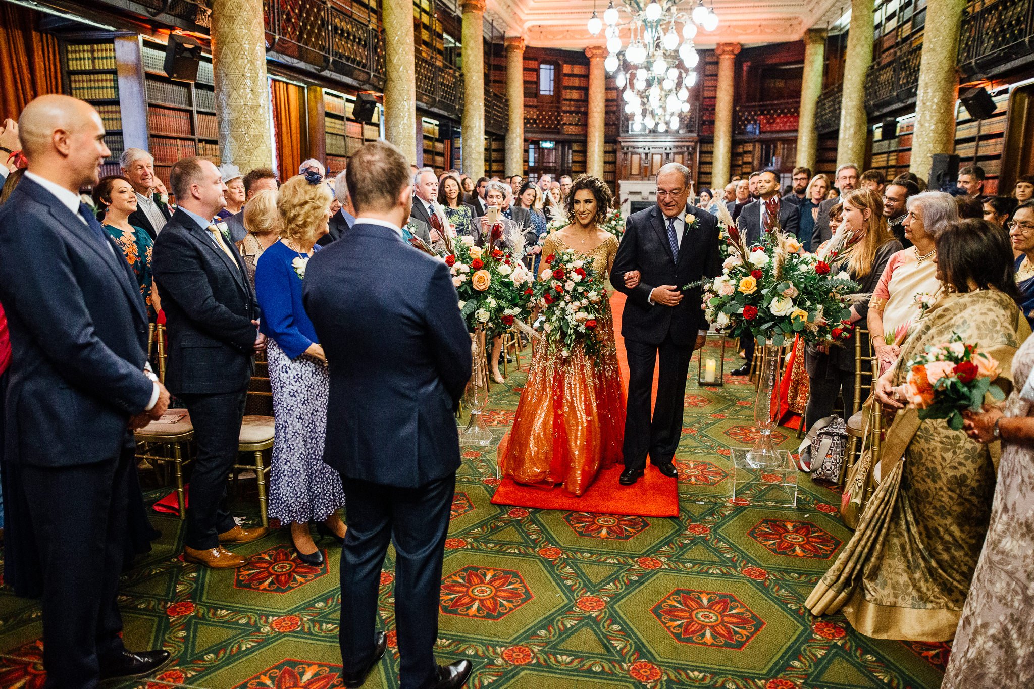  Bride in the library room during the wedding ceremony at One Whitehall Place London 