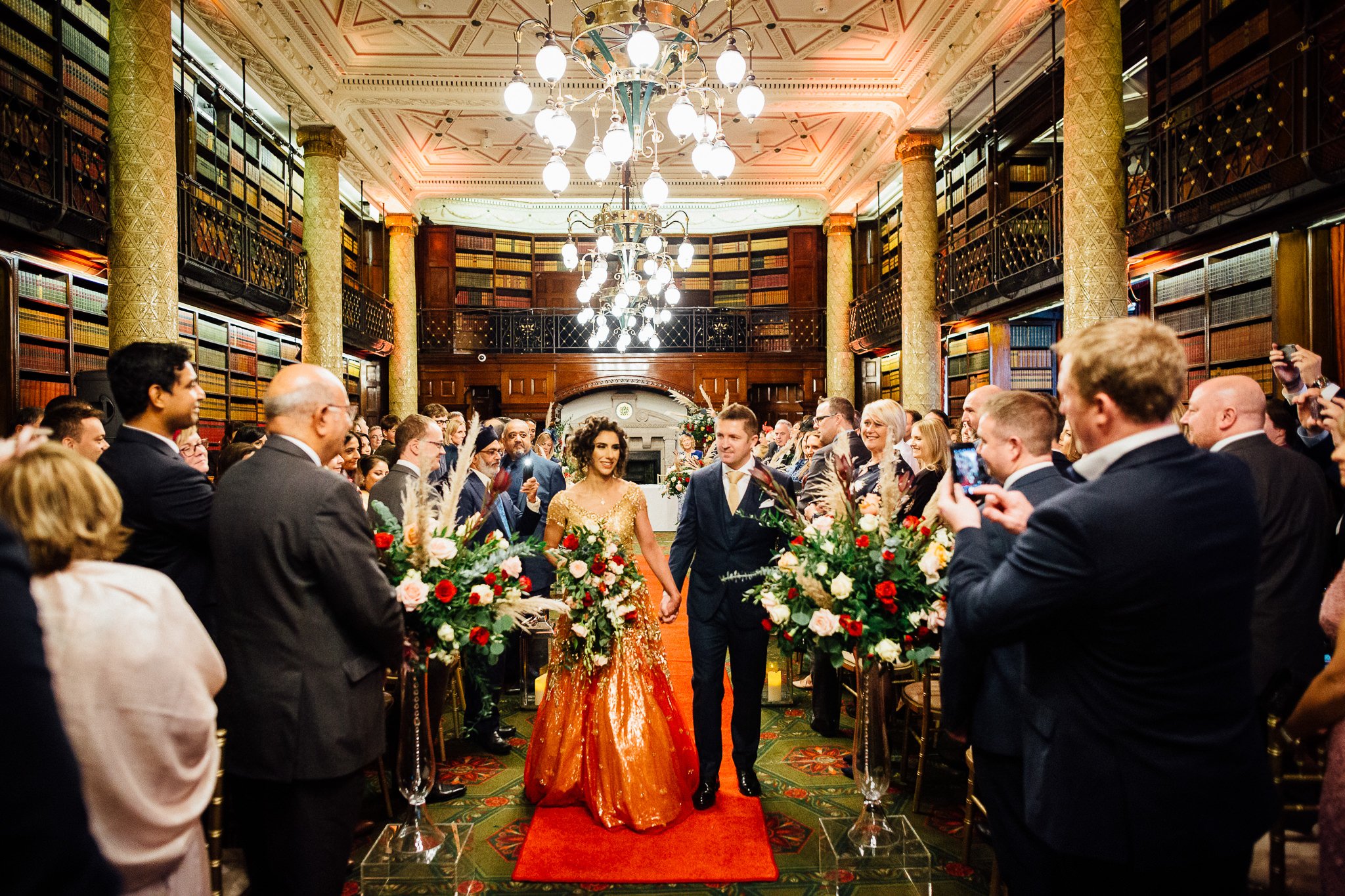  Bride and Groom walking down the aisle after being married at One Whitehall Place London 