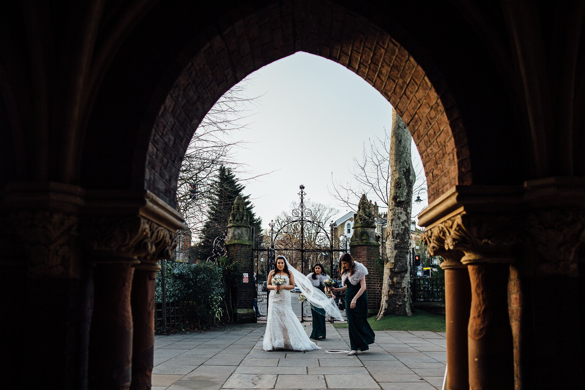  Bride walks to wards the entrance of St Stephen’s Trust Hampstead 