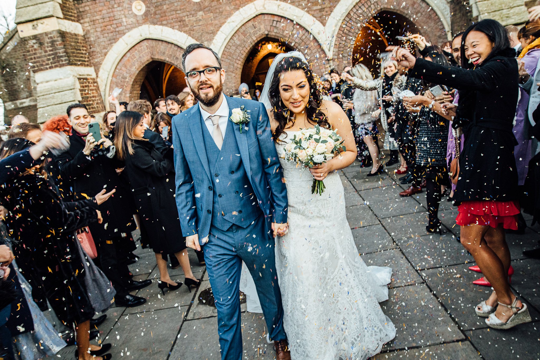  Bride and groom have confetti thrown at them outside St Stephen’s Trust Hampstead 