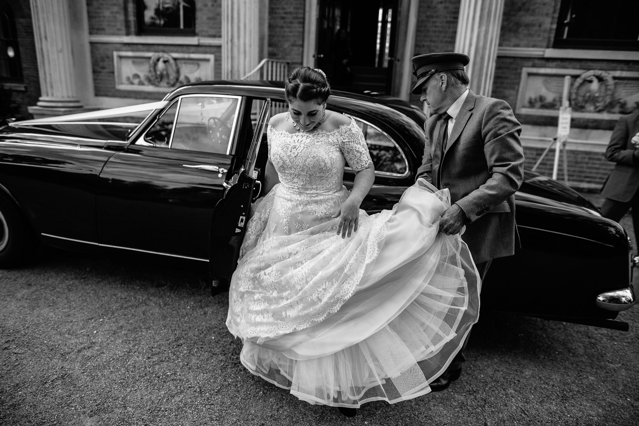  Bride gets out of the wedding car outside of  Pitzhanger Manor 