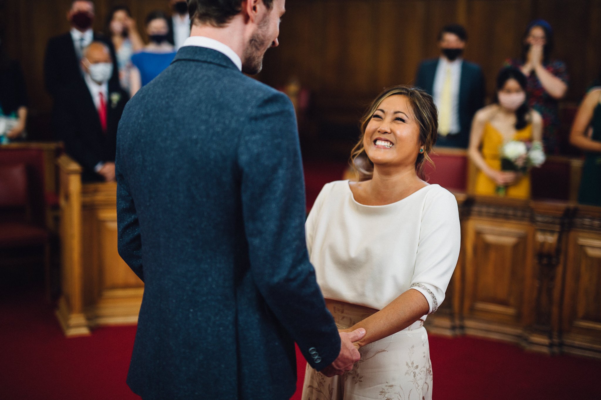  Bride smiling during the wedding ceremony at  Islington Town Hall 