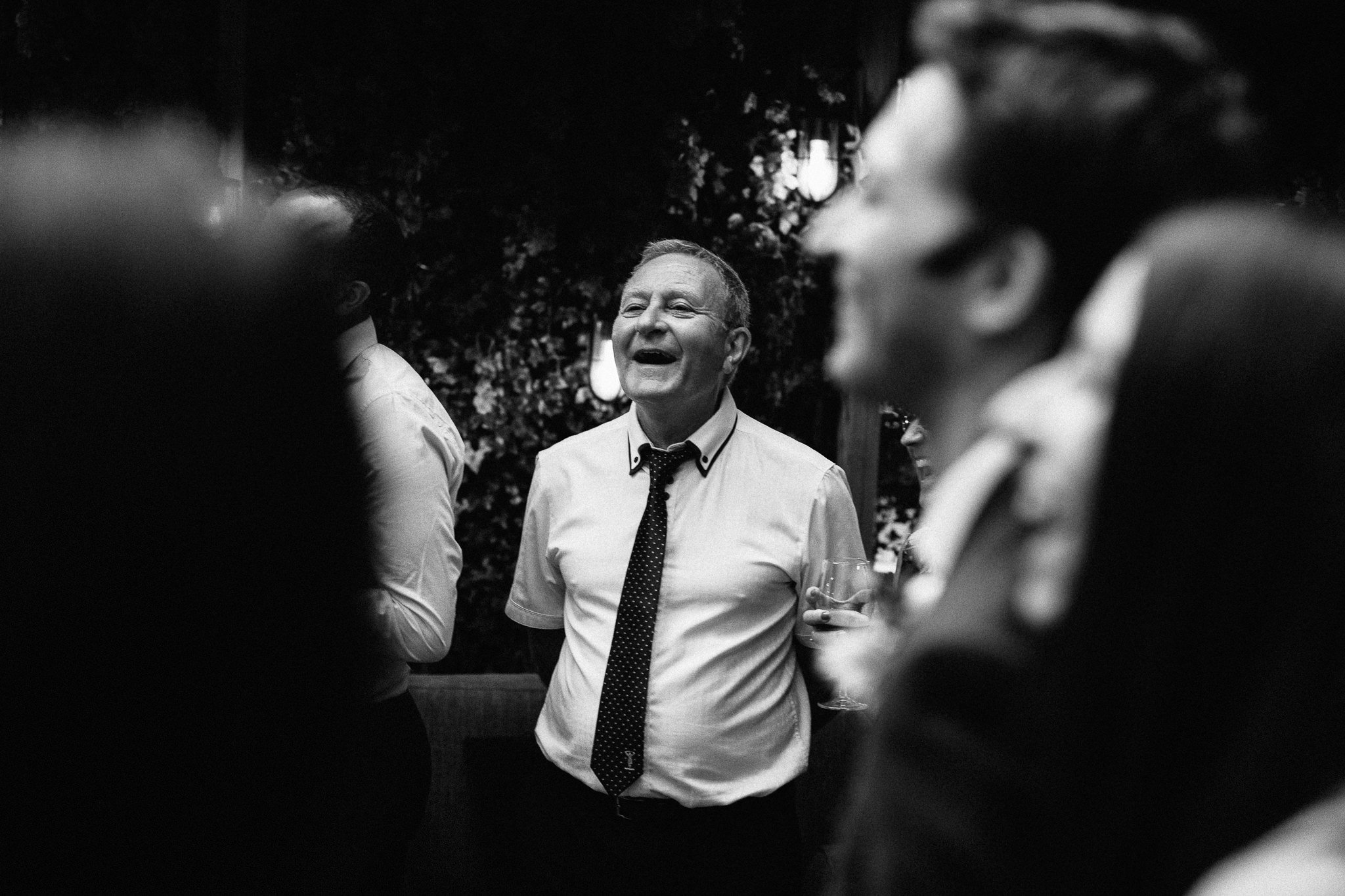  Groom’s father laughing 