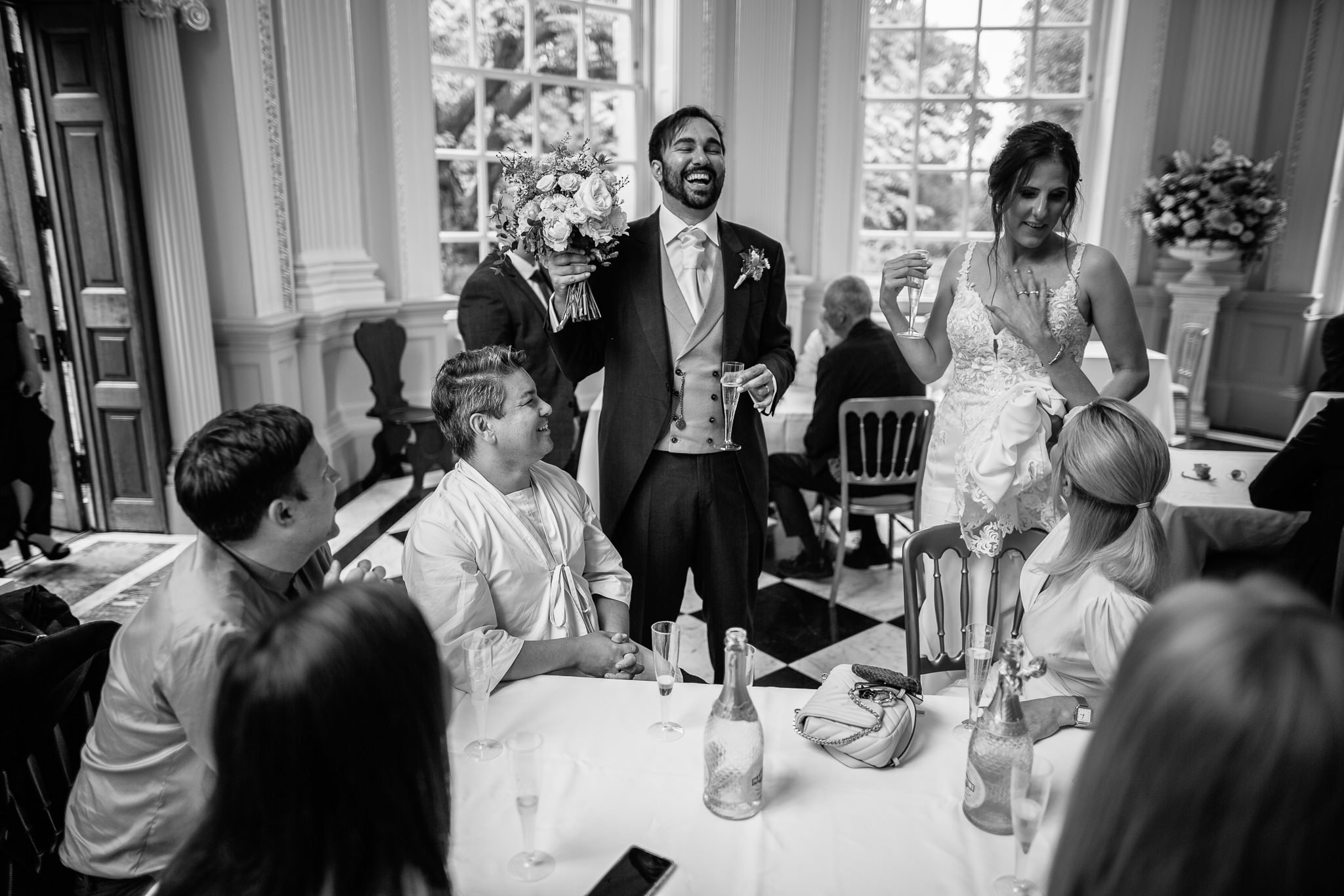  Groom laughing with his friends in the Octogan room at  Orleans House Gallery 