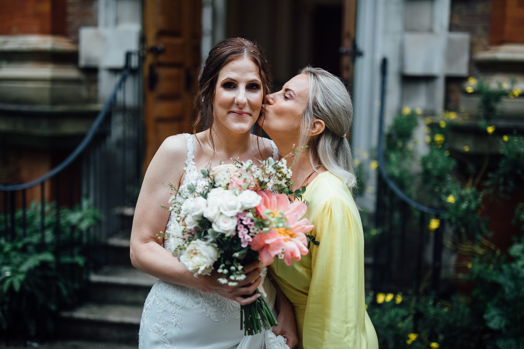  A friend kisses the Bride outside of  Orleans House Gallery 