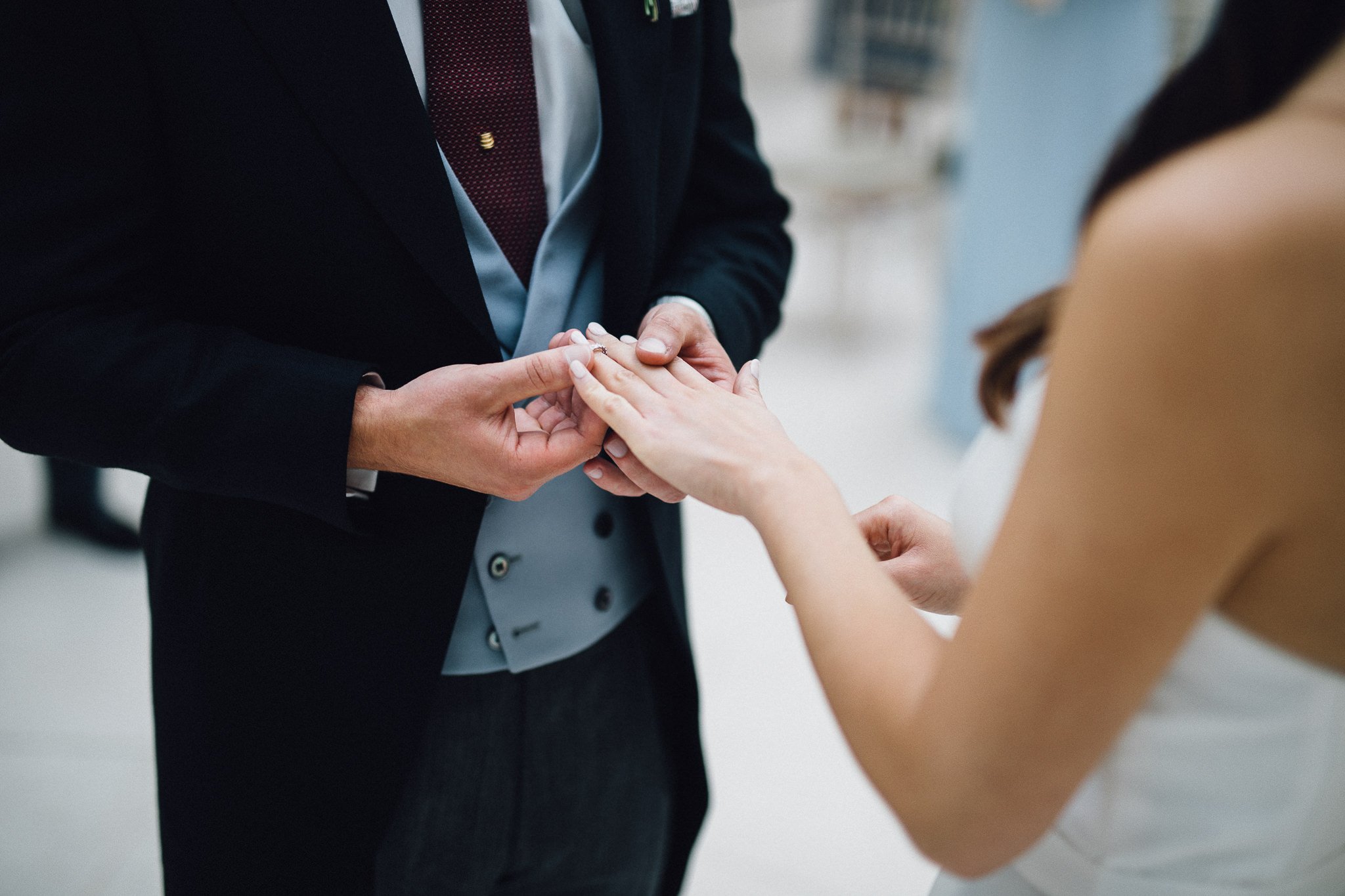  Groom puts the ring on the finger of the Bride at The Hurlingham Club  