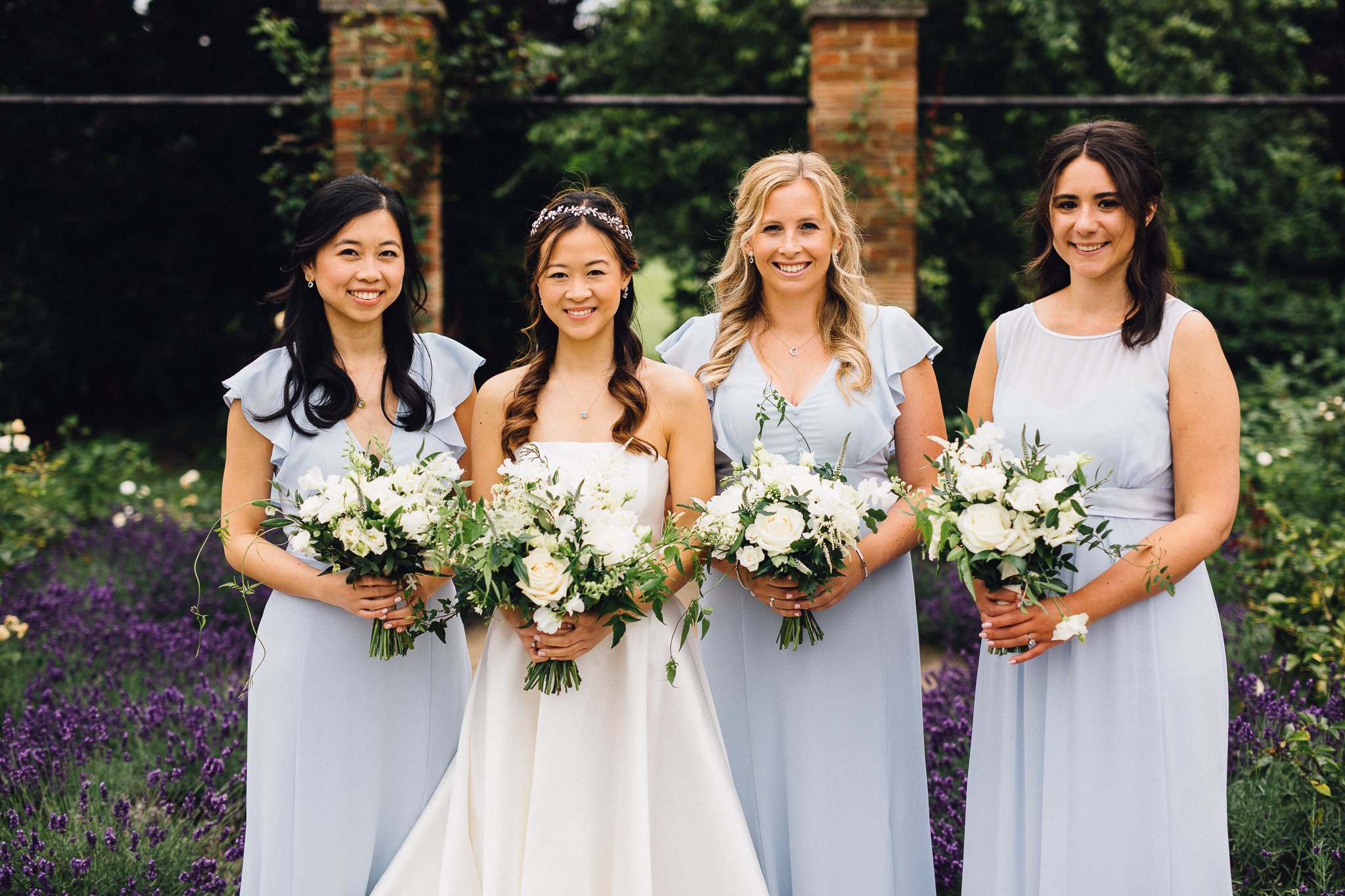  Bride and Bridesmaids with flower bouquets at Hurlingham Club 