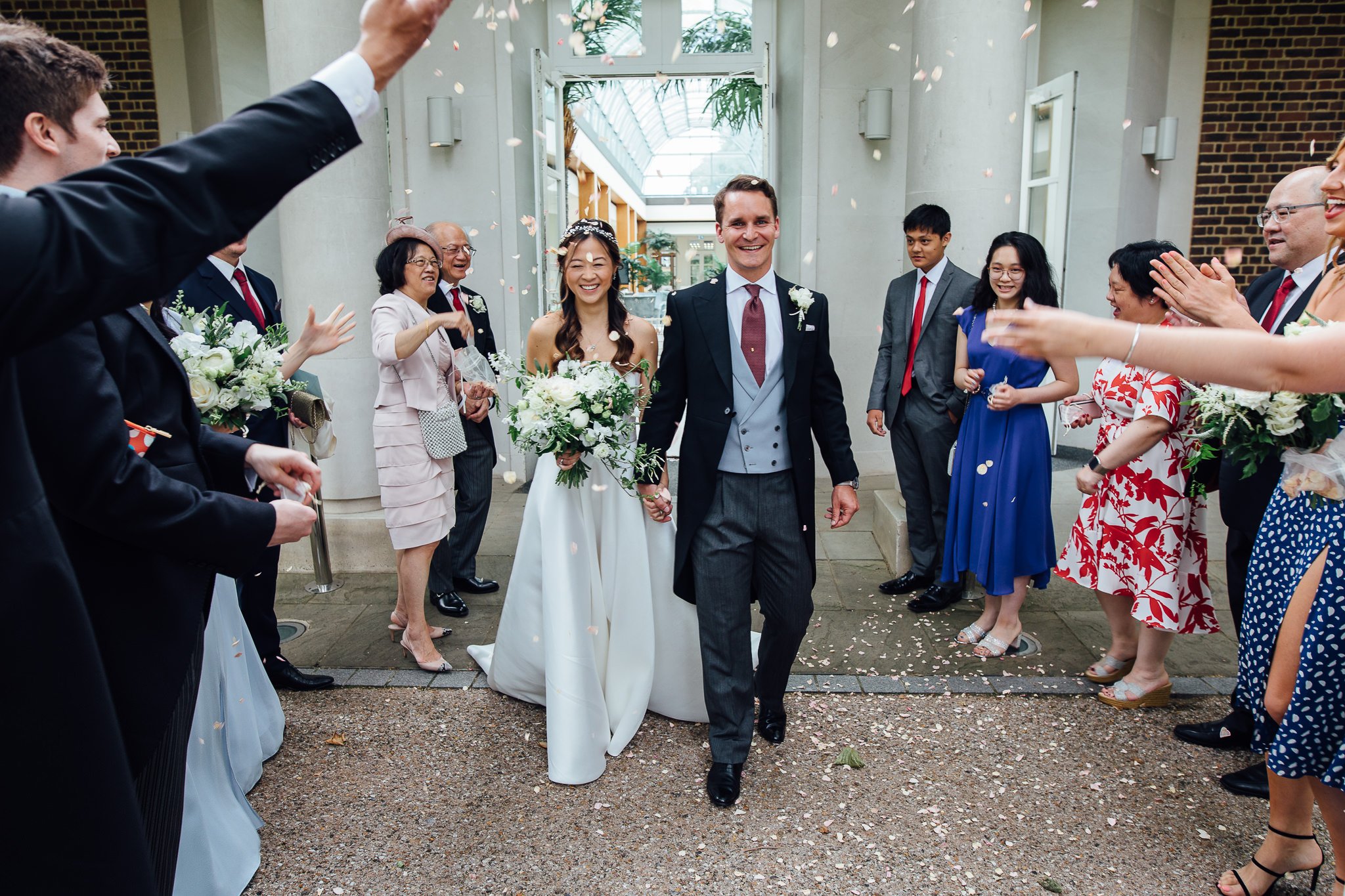  Bride and Groom have confetti thrown at them after their wedding ceremony at the Hurlingham Club 