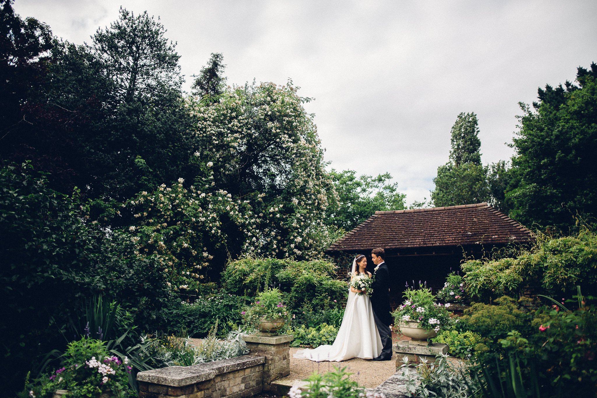  Bride and Groom in the leafy grounds of the Hurlingham Club 